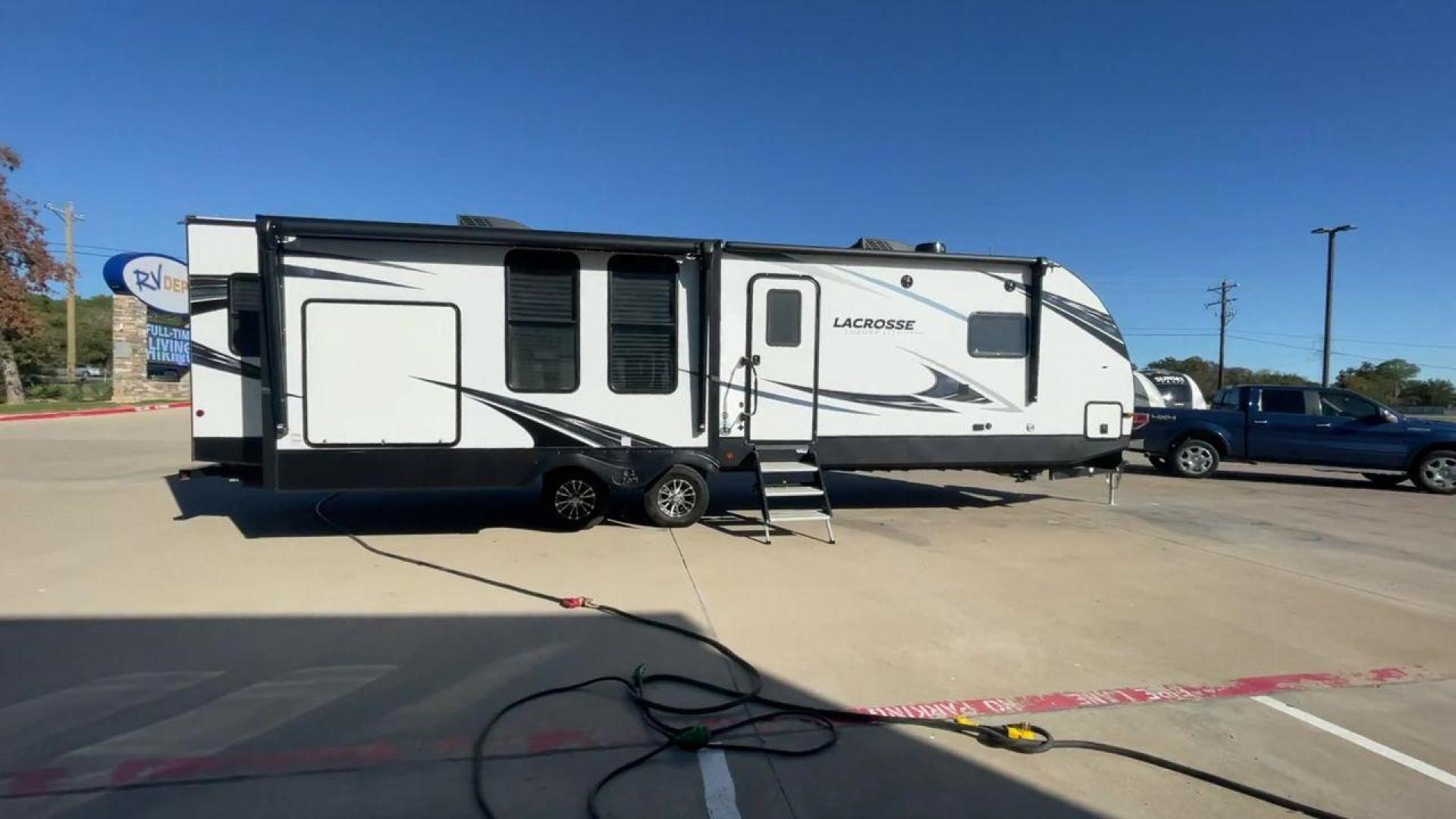 2021 FOREST RIVER LACROSSE 3399SE (5ZT2LCZB5MB) , Length: 37.58 ft. | Dry Weight: 8,678 lbs. | Slides: 3 transmission, located at 4319 N Main Street, Cleburne, TX, 76033, (817) 221-0660, 32.435829, -97.384178 - The 2021 Forest River LaCrosse 3399SE is a stunning travel trailer that seamlessly combines elegance with functionality. With a length of 37.58 feet, a dry weight of 8,678 lbs, and three slides, this model offers a spacious and well-balanced interior for a luxurious camping experience. The large kit - Photo#2