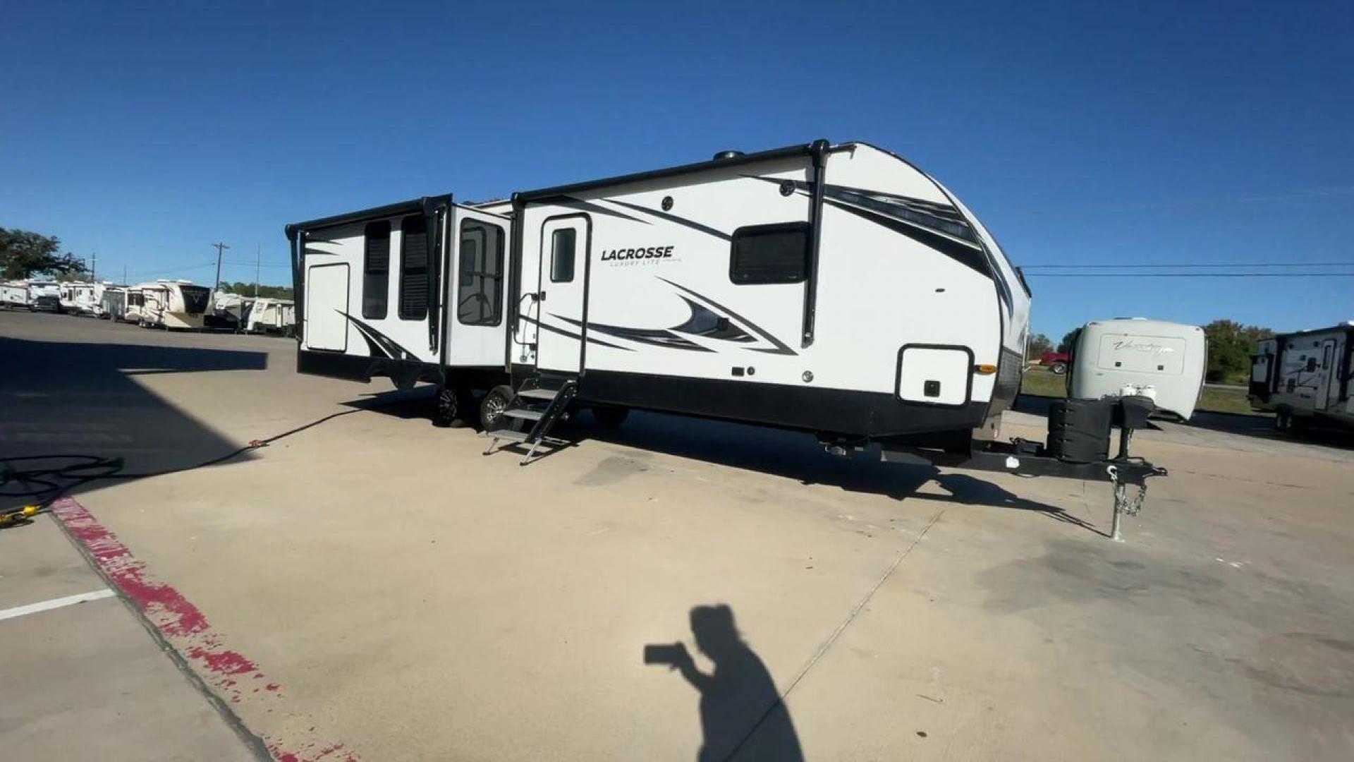 2021 FOREST RIVER LACROSSE 3399SE (5ZT2LCZB5MB) , Length: 37.58 ft. | Dry Weight: 8,678 lbs. | Slides: 3 transmission, located at 4319 N Main Street, Cleburne, TX, 76033, (817) 221-0660, 32.435829, -97.384178 - The 2021 Forest River LaCrosse 3399SE is a stunning travel trailer that seamlessly combines elegance with functionality. With a length of 37.58 feet, a dry weight of 8,678 lbs, and three slides, this model offers a spacious and well-balanced interior for a luxurious camping experience. The large kit - Photo#3