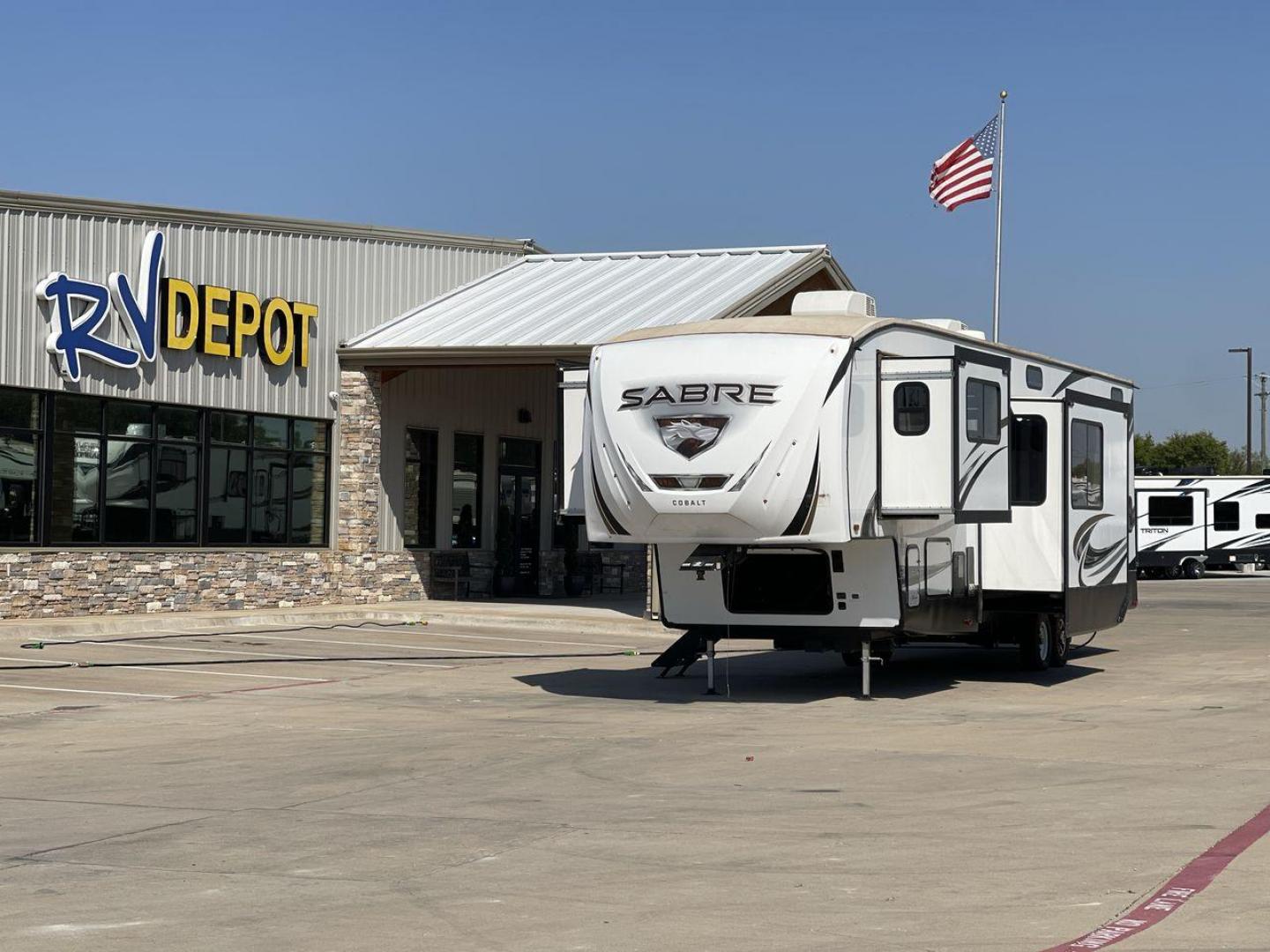 2021 FOREST RIVER SABRE 37FLL (5ZT3SR2B3M6) , Length: 42.75 ft. | Dry Weight: 11,918 lbs. | Slides: 4 transmission, located at 4319 N Main Street, Cleburne, TX, 76033, (817) 221-0660, 32.435829, -97.384178 - The 2021 Forest River Sabre 37FLL is a large, luxurious fifth-wheel trailer that measures 42.75 feet in length and features four slide-outs. It has an aerodynamic front cap with the Sabre Cobalt logo and bold, modern graphics. The curved front end is designed to reduce wind drag when towing. The rea - Photo#0