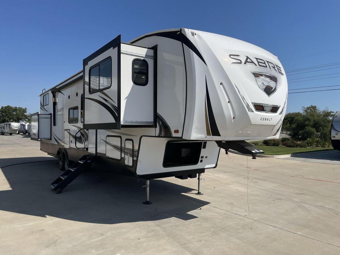 2021 FOREST RIVER SABRE 37FLL (5ZT3SR2B3M6) , Length: 42.75 ft. | Dry Weight: 11,918 lbs. | Slides: 4 transmission, located at 4319 N Main Street, Cleburne, TX, 76033, (817) 221-0660, 32.435829, -97.384178 - The 2021 Forest River Sabre 37FLL is a large, luxurious fifth-wheel trailer that measures 42.75 feet in length and features four slide-outs. It has an aerodynamic front cap with the Sabre Cobalt logo and bold, modern graphics. The curved front end is designed to reduce wind drag when towing. The rea - Photo#23