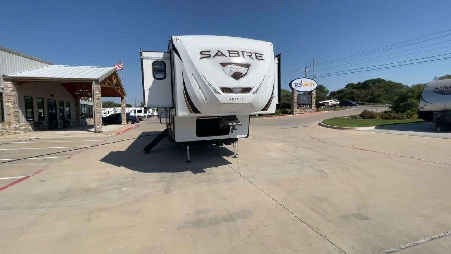 2021 FOREST RIVER SABRE 37FLL (5ZT3SR2B3M6) , Length: 42.75 ft. | Dry Weight: 11,918 lbs. | Slides: 4 transmission, located at 4319 N Main Street, Cleburne, TX, 76033, (817) 221-0660, 32.435829, -97.384178 - The 2021 Forest River Sabre 37FLL is a large, luxurious fifth-wheel trailer that measures 42.75 feet in length and features four slide-outs. It has an aerodynamic front cap with the Sabre Cobalt logo and bold, modern graphics. The curved front end is designed to reduce wind drag when towing. The rea - Photo#4