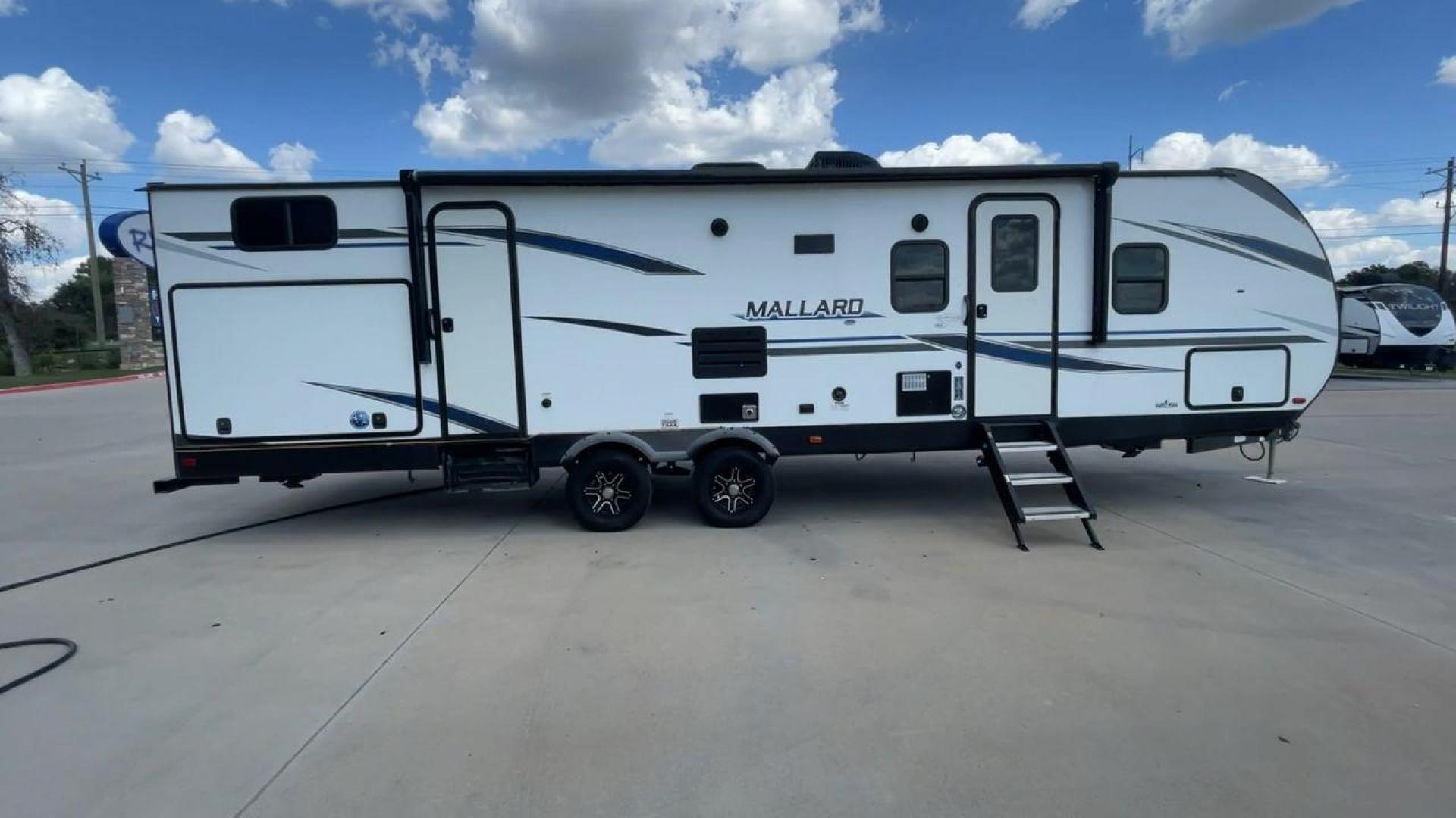 2021 HEARTLAND MALLARD M32 (5SFNB3524ME) , Length: 34.79 ft. | Dry Weight: 6,926 lbs. | Gross Weight: 8,600 lbs. | Slides: 2 transmission, located at 4319 N Main Street, Cleburne, TX, 76033, (817) 221-0660, 32.435829, -97.384178 - The 2021 Heartland Mallard M32 is a sleek and modern travel trailer with a length of 34.79 feet and a dry weight of 6,926 lbs. The gross weight is 8,600 lbs, making it easily towable by larger SUVs and trucks. It features a clean, white exterior with stylish blue and black decals that run along the - Photo#2