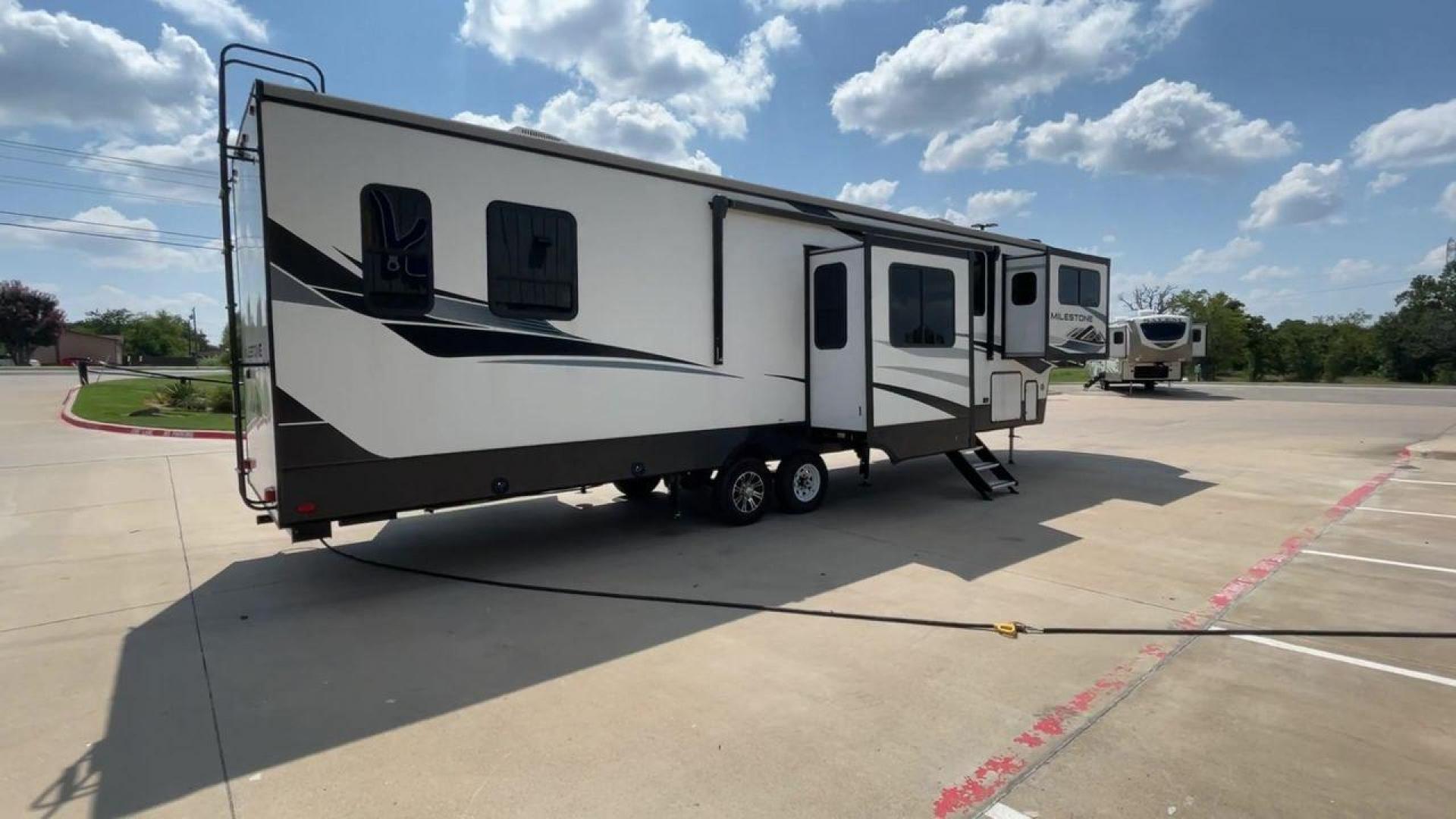 2021 HEARTLAND MILESTONE 379FLML (5SFMG4426ME) , Length: 44.17 ft. | Dry Weight: 12,600 lbs. | Gross Weight: 15,000 lbs. | Slides: 5 transmission, located at 4319 N Main Street, Cleburne, TX, 76033, (817) 221-0660, 32.435829, -97.384178 - The 2021 Heartland Milestone 379FLML is 44.17 feet in length and has a dry weight of 12,600 pounds, with a gross weight capability of 15,000 pounds. This type of RV is intended for extended living and luxurious travel. It comes with five slide-outs that dramatically increase interior space, creating - Photo#1