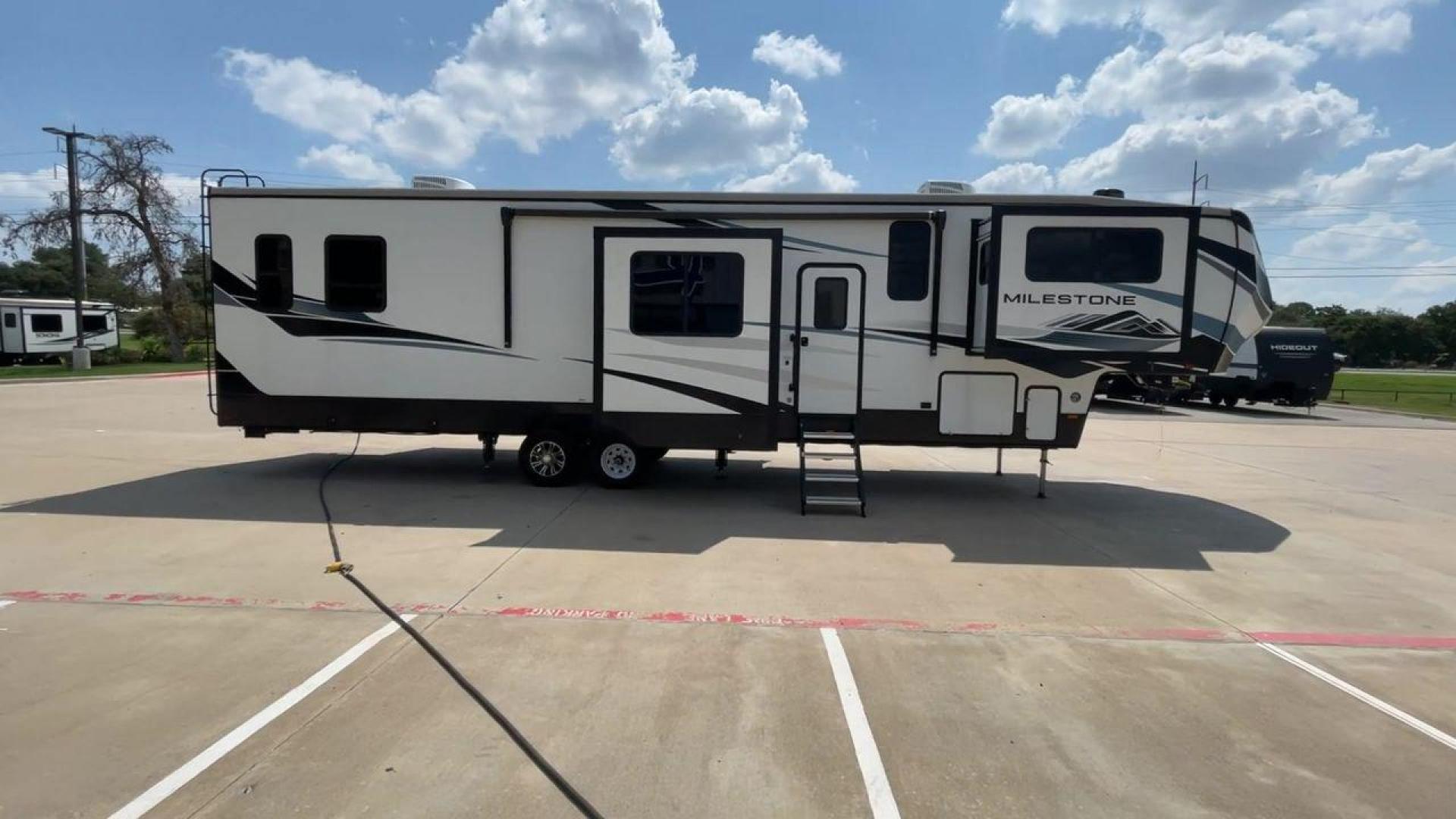 2021 HEARTLAND MILESTONE 379FLML (5SFMG4426ME) , Length: 44.17 ft. | Dry Weight: 12,600 lbs. | Gross Weight: 15,000 lbs. | Slides: 5 transmission, located at 4319 N Main Street, Cleburne, TX, 76033, (817) 221-0660, 32.435829, -97.384178 - The 2021 Heartland Milestone 379FLML is 44.17 feet in length and has a dry weight of 12,600 pounds, with a gross weight capability of 15,000 pounds. This type of RV is intended for extended living and luxurious travel. It comes with five slide-outs that dramatically increase interior space, creating - Photo#2