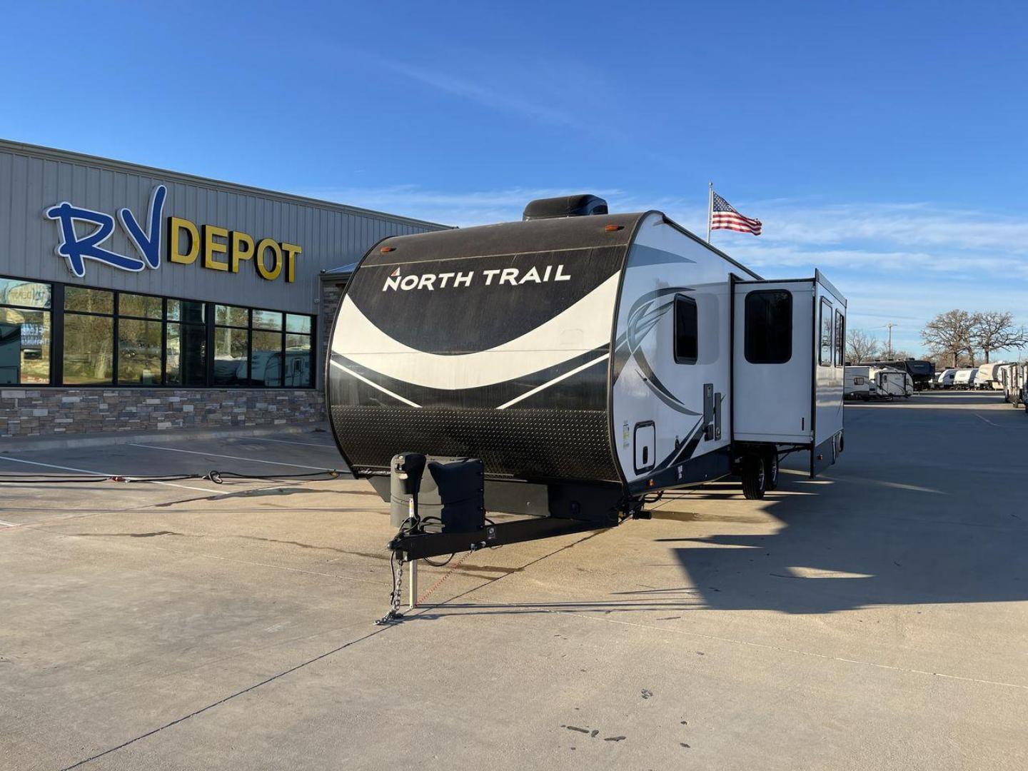 2021 HEARTLAND NORTH TRAIL 33BHDS (5SFNB3827ME) , Length: 37.62 ft | Dry Weight: 8,015 lbs | Gross Weight: 9,600 lbs | Slides: 3 transmission, located at 4319 N Main Street, Cleburne, TX, 76033, (817) 221-0660, 32.435829, -97.384178 - The 2021 Heartland North Trail 33BHDS is a family-friendly travel trailer that combines modern amenities with spacious living. This 37-foot model features three slide-outs, providing ample room for the master bedroom with a queen-size bed and dual wardrobes, while the bunkhouse offers a cozy retreat - Photo#0