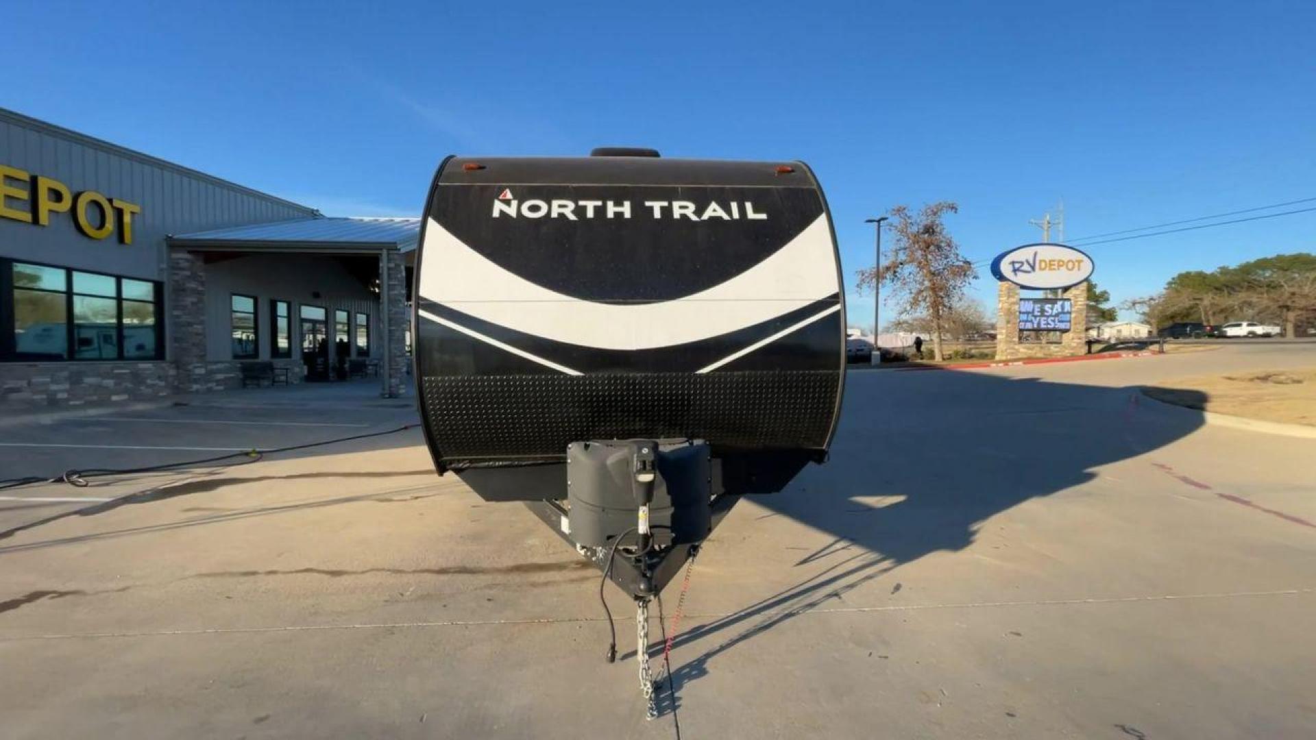 2021 HEARTLAND NORTH TRAIL 33BHDS (5SFNB3827ME) , Length: 37.62 ft | Dry Weight: 8,015 lbs | Gross Weight: 9,600 lbs | Slides: 3 transmission, located at 4319 N Main Street, Cleburne, TX, 76033, (817) 221-0660, 32.435829, -97.384178 - The 2021 Heartland North Trail 33BHDS is a family-friendly travel trailer that combines modern amenities with spacious living. This 37-foot model features three slide-outs, providing ample room for the master bedroom with a queen-size bed and dual wardrobes, while the bunkhouse offers a cozy retreat - Photo#4