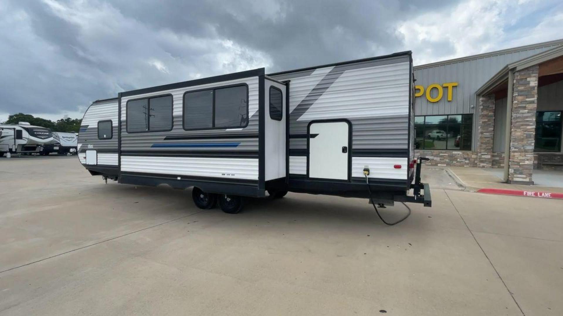 2021 WHITE HEARTLAND PIONEER BH322 (5SFPB3721ME) , Length: 36.92 ft. | Dry Weight: 7,436 lbs. | Gross Weight: 9,000 lbs. | Slides: 1 transmission, located at 4319 N Main Street, Cleburne, TX, 76033, (817) 221-0660, 32.435829, -97.384178 - This 2021 Heartland Pioneer BH322 travel trailer measures 36.92 ft in length, 8.04 ft in width, 11.33 ft in height, and 6.67 ft interior height. This unit is easily towable with only 7,436 lbs dry weight with a payload capacity of 1,548 lbs. The unit has a GVWR of 9,000 lbs and a hitch weight of 788 - Photo#7