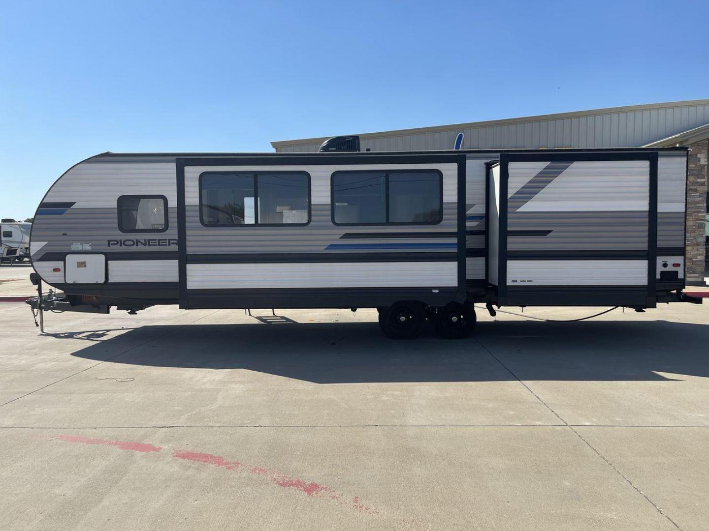 2021 HEARTLAND PIONEER DS320 (5SFPB3725ME) , Length: 37.42 ft. | Dry Weight: 7,696 lbs. | Gross Weight: 9,000 lbs. | Slides: 2 transmission, located at 4319 N Main Street, Cleburne, TX, 76033, (817) 221-0660, 32.435829, -97.384178 - The 2021 Heartland Pioneer DS320 is a spacious and well-designed travel trailer, perfect for large families or group trips. Measuring 37.42 feet in length with a dry weight of 7,696 lbs. and a gross weight of 9,000 lbs., this unit is built for comfortable travel while maintaining a manageable towing - Photo#24