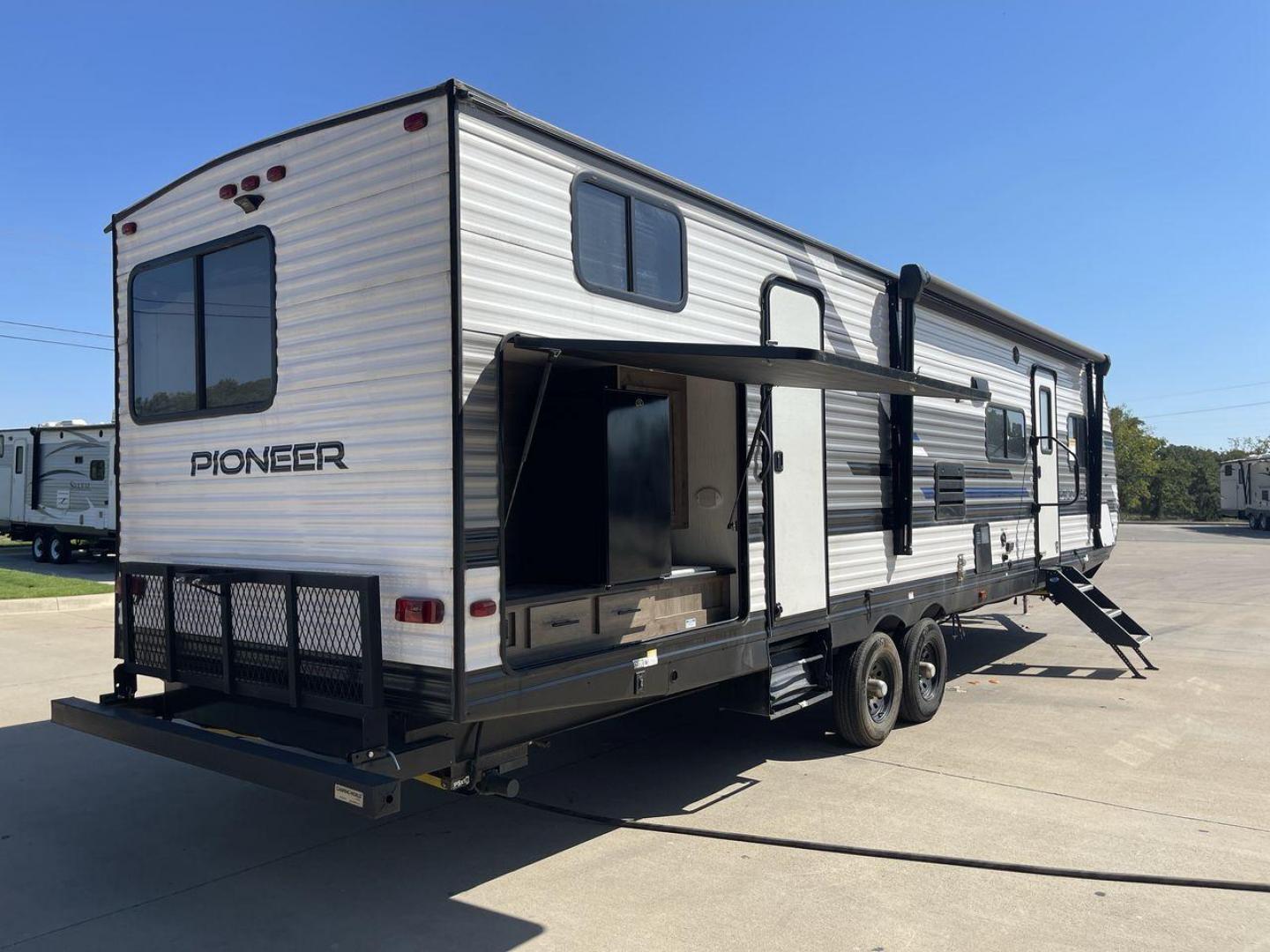 2021 HEARTLAND PIONEER DS320 (5SFPB3725ME) , Length: 37.42 ft. | Dry Weight: 7,696 lbs. | Gross Weight: 9,000 lbs. | Slides: 2 transmission, located at 4319 N Main Street, Cleburne, TX, 76033, (817) 221-0660, 32.435829, -97.384178 - The 2021 Heartland Pioneer DS320 is a spacious and well-designed travel trailer, perfect for large families or group trips. Measuring 37.42 feet in length with a dry weight of 7,696 lbs. and a gross weight of 9,000 lbs., this unit is built for comfortable travel while maintaining a manageable towing - Photo#25