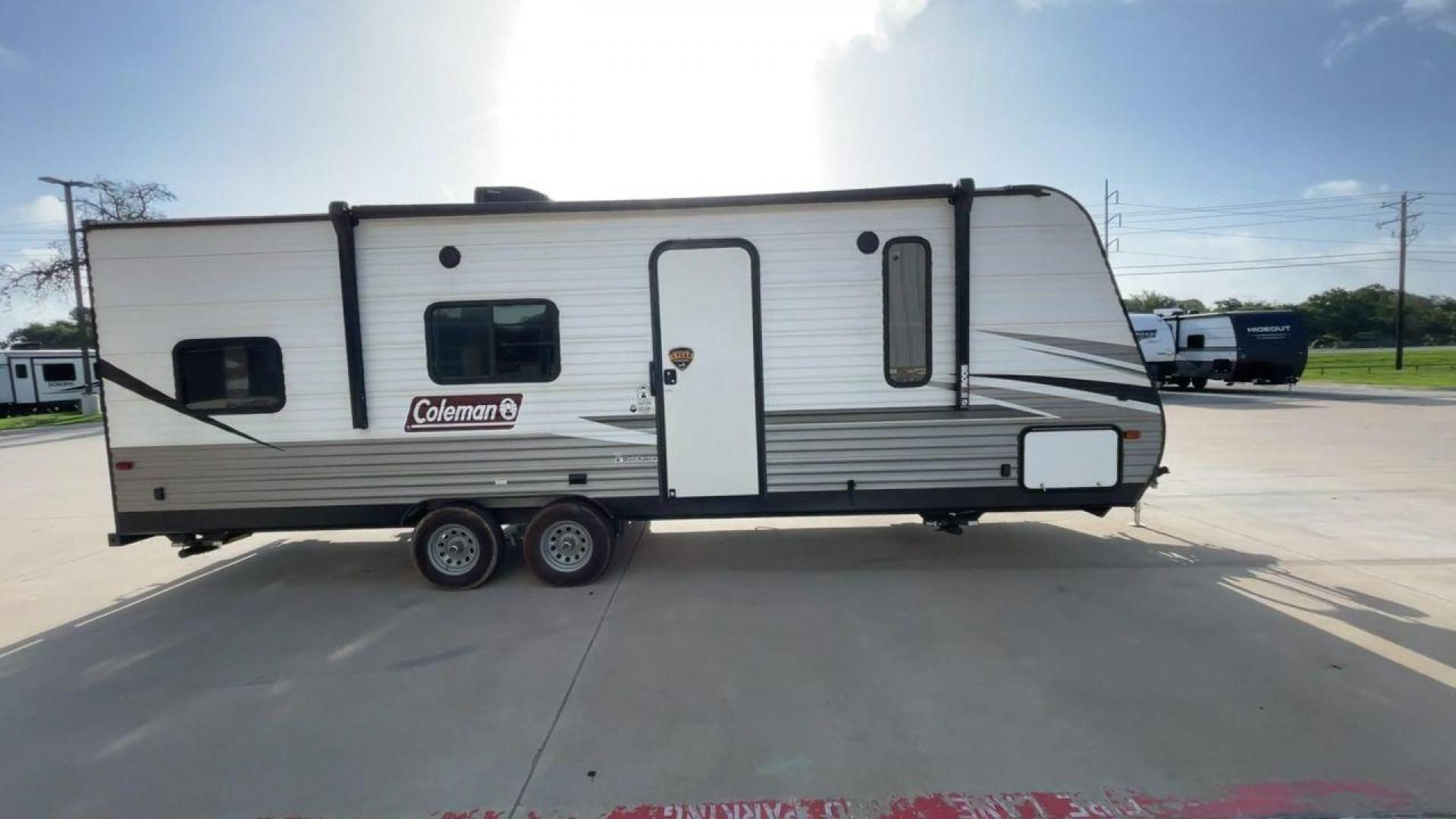 2021 WHITE KEYSTONE COLEMAN 274BH (4YDT27429MH) , Length: 28.58 ft. | Dry Weight: 4,789 lbs. | Slides: 0 transmission, located at 4319 N Main Street, Cleburne, TX, 76033, (817) 221-0660, 32.435829, -97.384178 - Set out on an adventure-filled, comfortable journey in the 2021 Keystone Coleman 274BH travel trailer. Families looking for a fun and memorable camping trip will love this well-designed and adaptable travel companion. The dimensions of this unit are 28.58 ft in length, 8 ft in width, and 10.33 ft - Photo#2