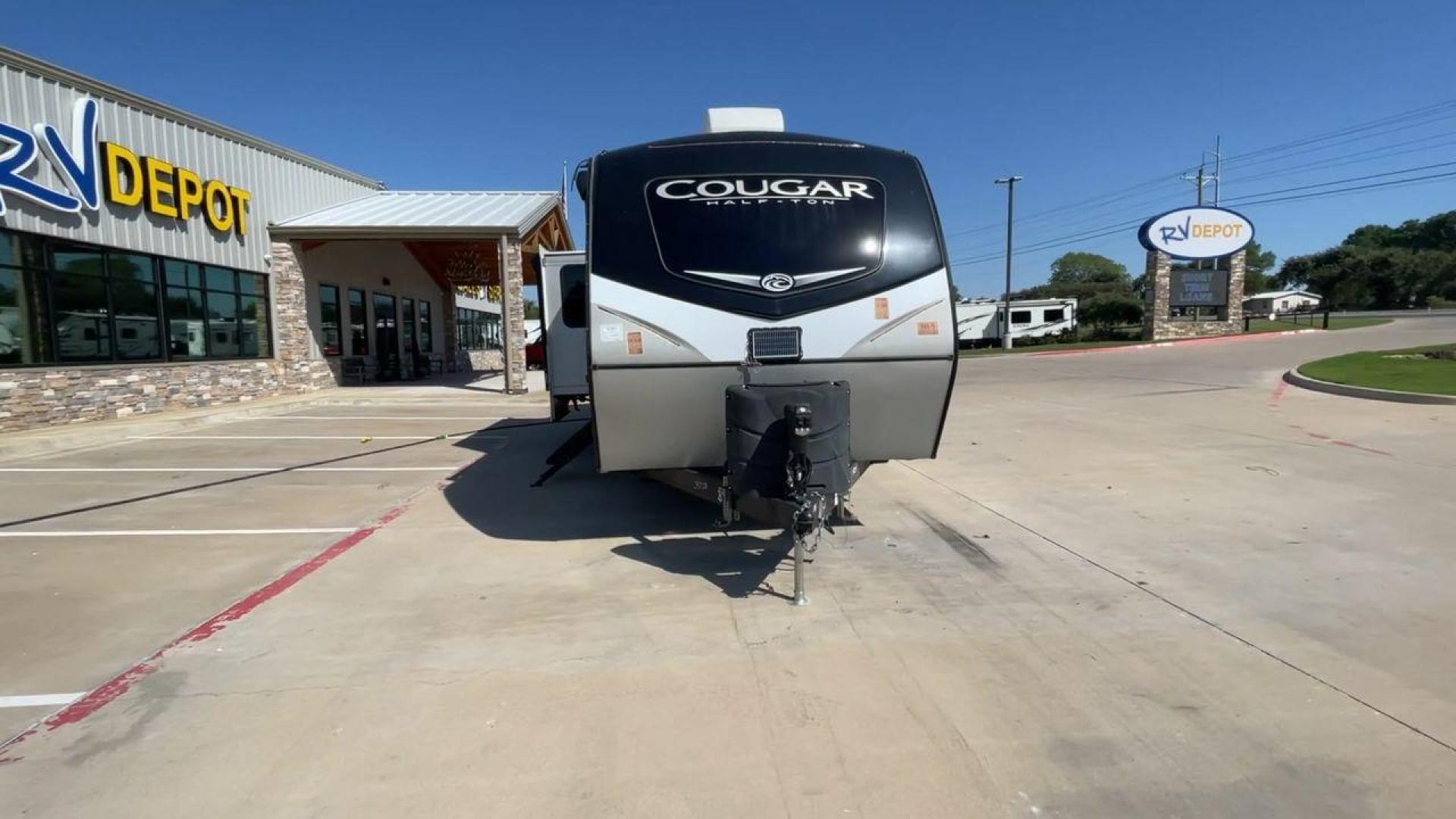 2021 KEYSTONE COUGAR 34TSB (4YDT34T26MV) , Length: 37.42 ft. | Dry Weight: 8,563 lbs. | Gross Weight: 10,500 lbs. | Slides: 3 transmission, located at 4319 N Main Street, Cleburne, TX, 76033, (817) 221-0660, 32.435829, -97.384178 - The 2021 Keystone Cougar 34TSB is a spacious and stylish travel trailer. With a total length of 37.42 feet and a dry weight of 8,563 lbs, it is both manageable for towing and expansive inside. Its sleek white exterior is accented with black and gray details, featuring bold Cougar branding on the fro - Photo#4