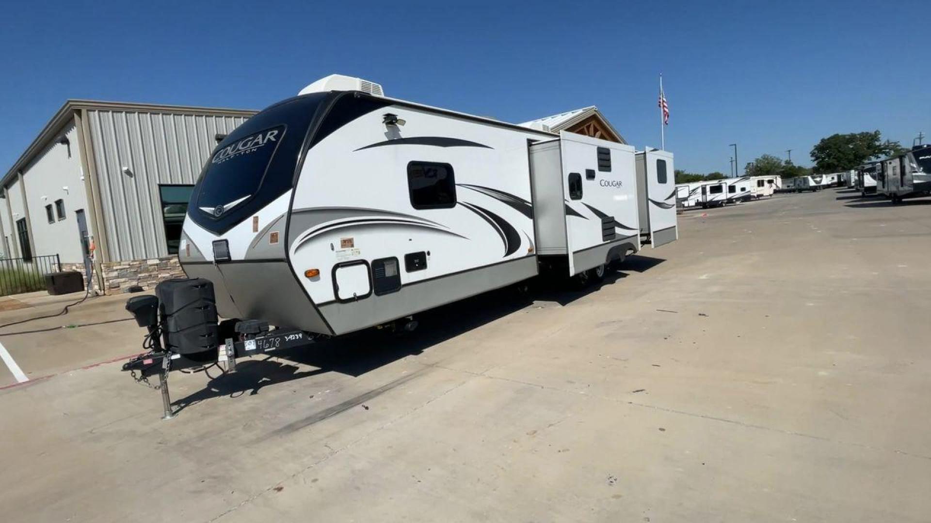 2021 KEYSTONE COUGAR 34TSB (4YDT34T26MV) , Length: 37.42 ft. | Dry Weight: 8,563 lbs. | Gross Weight: 10,500 lbs. | Slides: 3 transmission, located at 4319 N Main Street, Cleburne, TX, 76033, (817) 221-0660, 32.435829, -97.384178 - The 2021 Keystone Cougar 34TSB is a spacious and stylish travel trailer. With a total length of 37.42 feet and a dry weight of 8,563 lbs, it is both manageable for towing and expansive inside. Its sleek white exterior is accented with black and gray details, featuring bold Cougar branding on the fro - Photo#5