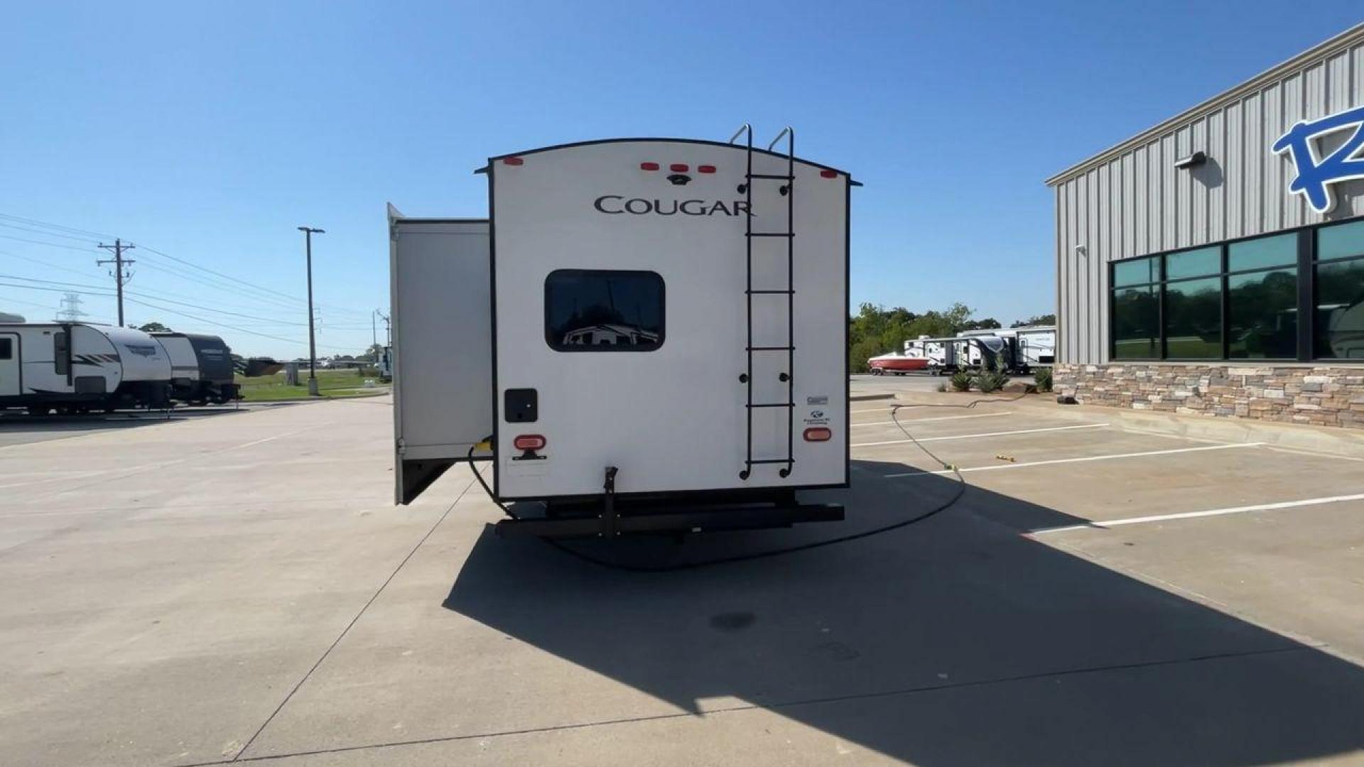 2021 KEYSTONE COUGAR 34TSB (4YDT34T26MV) , Length: 37.42 ft. | Dry Weight: 8,563 lbs. | Gross Weight: 10,500 lbs. | Slides: 3 transmission, located at 4319 N Main Street, Cleburne, TX, 76033, (817) 221-0660, 32.435829, -97.384178 - The 2021 Keystone Cougar 34TSB is a spacious and stylish travel trailer. With a total length of 37.42 feet and a dry weight of 8,563 lbs, it is both manageable for towing and expansive inside. Its sleek white exterior is accented with black and gray details, featuring bold Cougar branding on the fro - Photo#8