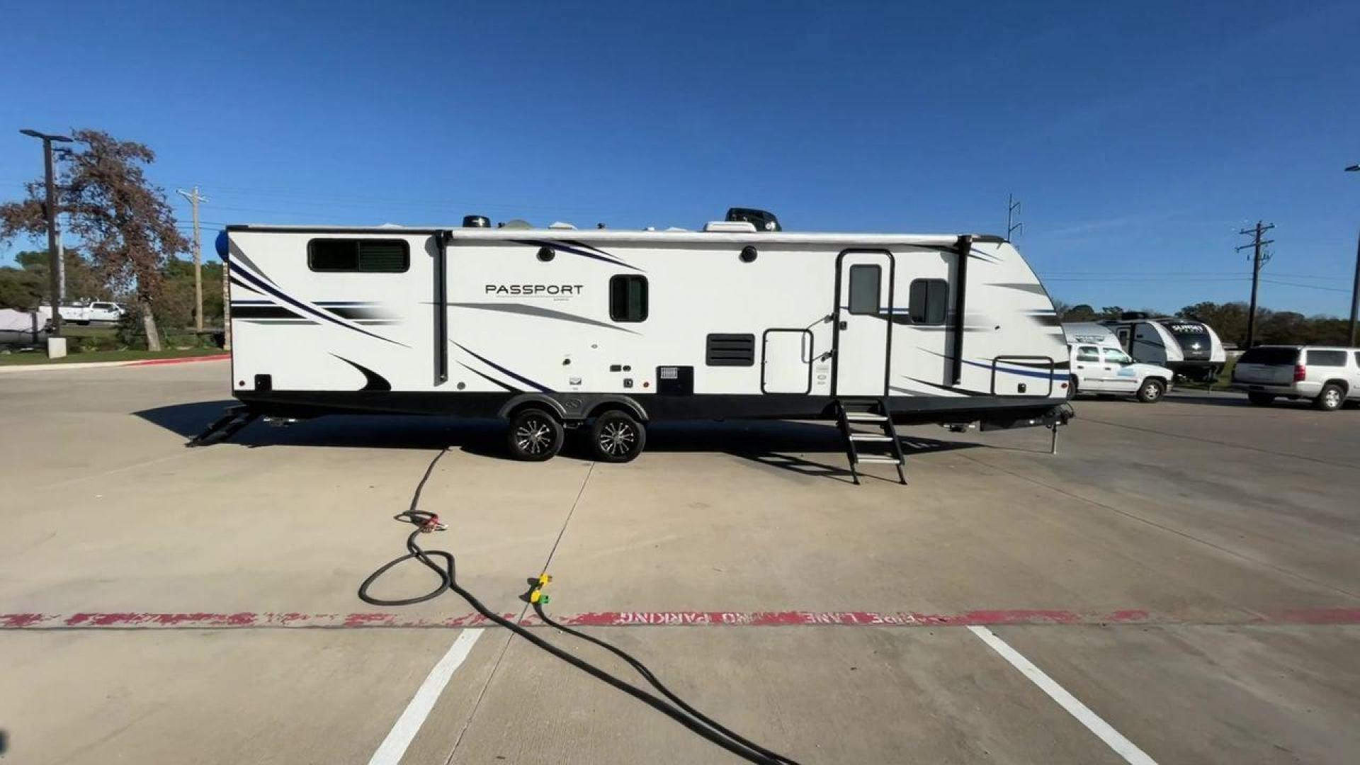 2021 KEYSTONE PASSPORT 3400QD (4YDT34020MK) , Length: 38.33 ft | Dry Weight: 7,525 lbs. | Gross Weight: 9,640 lbs | Slides: 2 transmission, located at 4319 N Main Street, Cleburne, TX, 76033, (817) 221-0660, 32.435829, -97.384178 - Discover the ultimate in camping luxury with the 2021 Keystone Passport 3400QD. This travel trailer is expertly crafted to provide you with unparalleled comfort, innovative features, and spacious living areas. This model is perfect for those who value spaciousness and easy towing. With a length of 3 - Photo#2