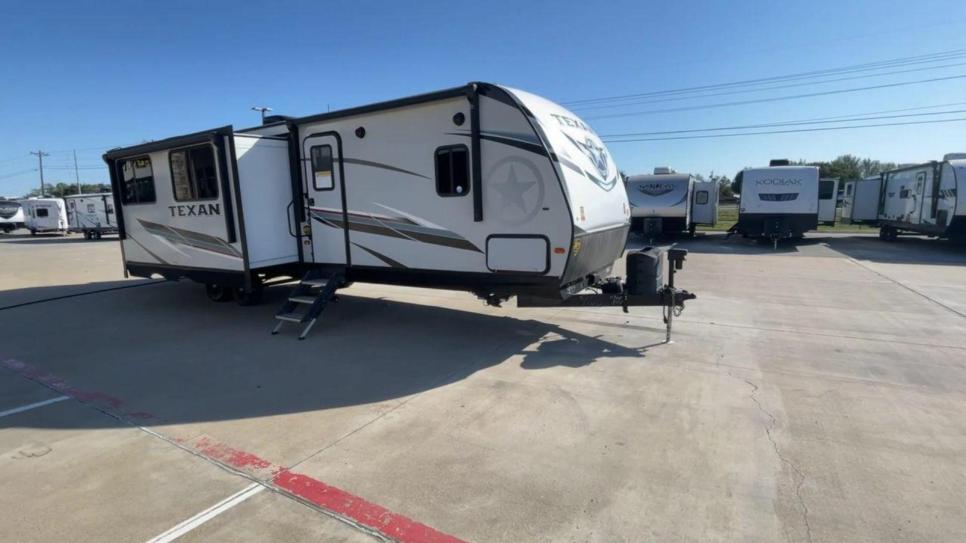 2021 KEYSTONE TEXAN 33DB (4YDT33D22M6) , located at 4319 N Main Street, Cleburne, TX, 76033, (817) 221-0660, 32.435829, -97.384178 - The 2021 Keystone Texan 33DB is an exceptional travel trailer that combines luxury, comfort, and practicality. Measuring 37 feet in length, this RV provides ample space for all your travel needs. The exterior is equipped with a rear, solid ladder for roof access, ensuring convenience for maintenance - Photo#3