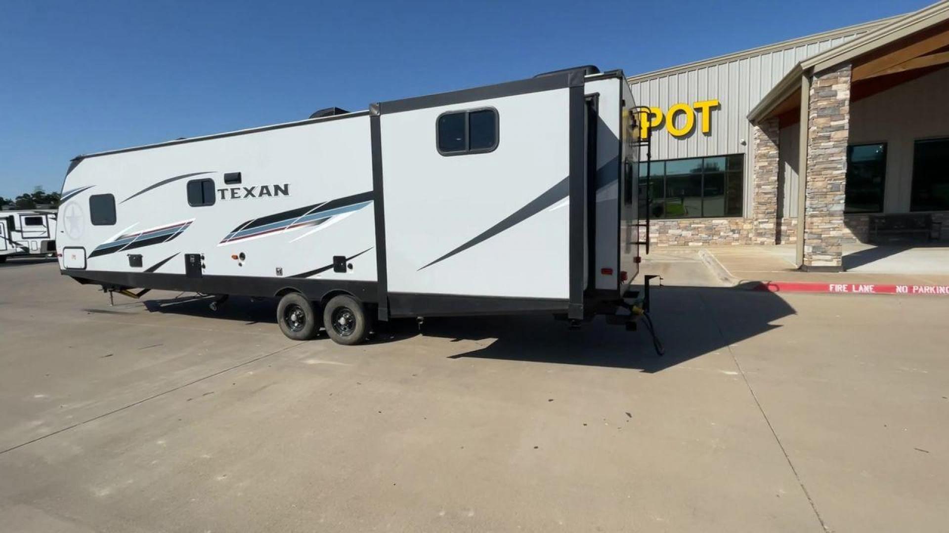 2021 KEYSTONE TEXAN 33DB (4YDT33D22M6) , located at 4319 N Main Street, Cleburne, TX, 76033, (817) 221-0660, 32.435829, -97.384178 - The 2021 Keystone Texan 33DB is an exceptional travel trailer that combines luxury, comfort, and practicality. Measuring 37 feet in length, this RV provides ample space for all your travel needs. The exterior is equipped with a rear, solid ladder for roof access, ensuring convenience for maintenance - Photo#7