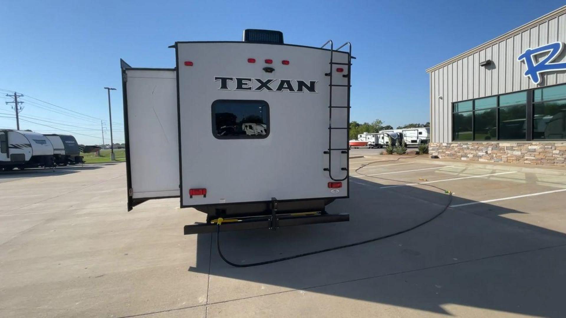 2021 KEYSTONE TEXAN 33DB (4YDT33D22M6) , located at 4319 N Main Street, Cleburne, TX, 76033, (817) 221-0660, 32.435829, -97.384178 - The 2021 Keystone Texan 33DB is an exceptional travel trailer that combines luxury, comfort, and practicality. Measuring 37 feet in length, this RV provides ample space for all your travel needs. The exterior is equipped with a rear, solid ladder for roof access, ensuring convenience for maintenance - Photo#8