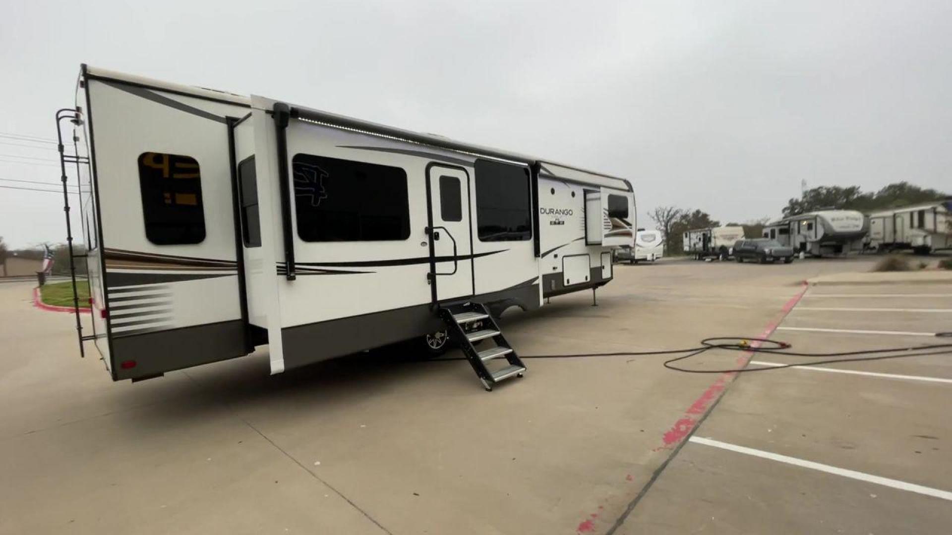 2021 K-Z DURANGO 383RLQ (4EZFV4224M6) , located at 4319 N Main Street, Cleburne, TX, 76033, (817) 221-0660, 32.435829, -97.384178 - If you're in the market for a top-of-the-line fifth wheel rear living RV, look no further than RV Depot in Cleburne, TX. We are excited to present to you the 2021 K-Z Durango 383RLQ, a luxurious and spacious RV that is perfect for all your travel adventures. With its outstanding features and excepti - Photo#1