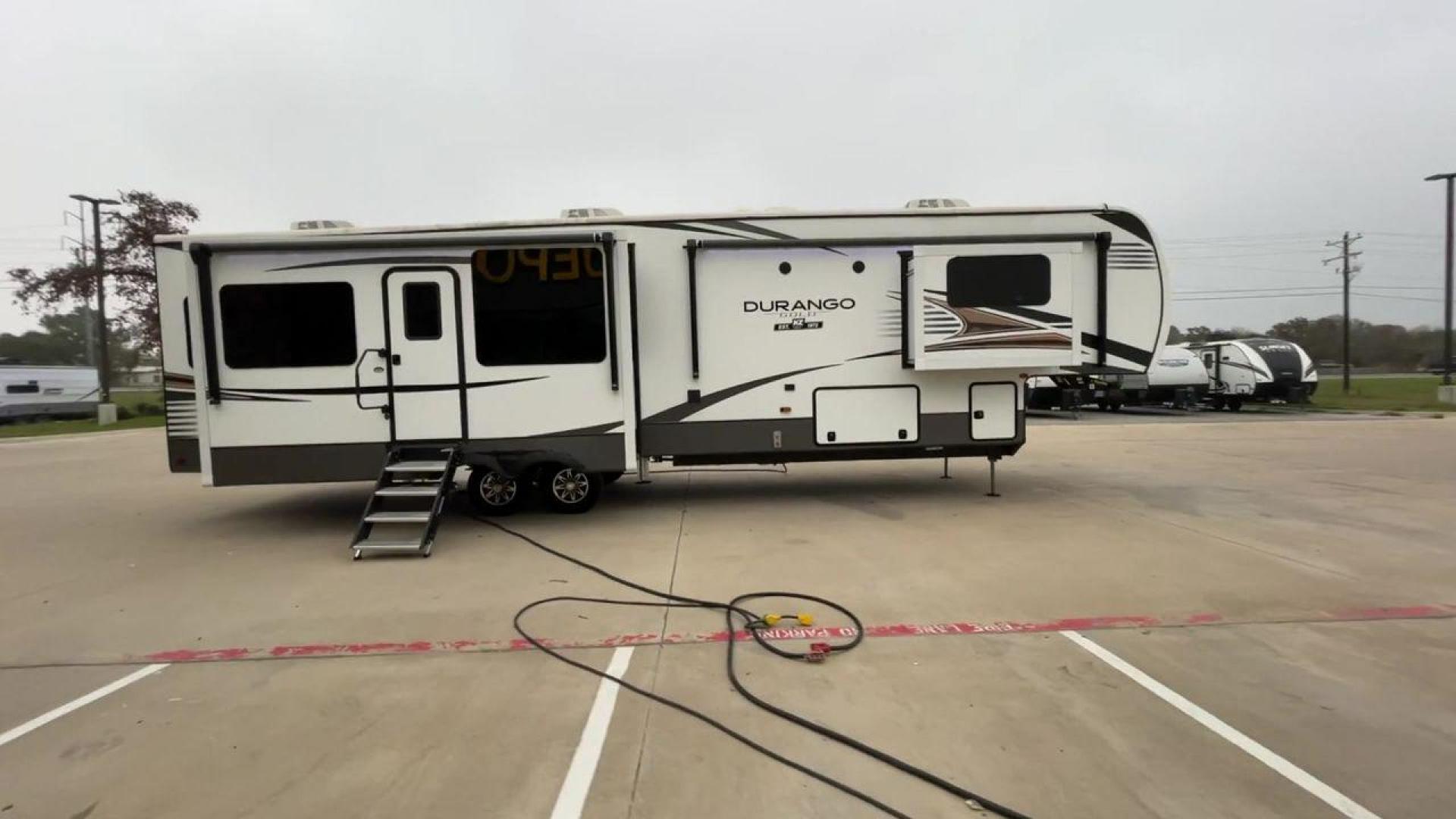 2021 K-Z DURANGO 383RLQ (4EZFV4224M6) , located at 4319 N Main Street, Cleburne, TX, 76033, (817) 221-0660, 32.435829, -97.384178 - If you're in the market for a top-of-the-line fifth wheel rear living RV, look no further than RV Depot in Cleburne, TX. We are excited to present to you the 2021 K-Z Durango 383RLQ, a luxurious and spacious RV that is perfect for all your travel adventures. With its outstanding features and excepti - Photo#2