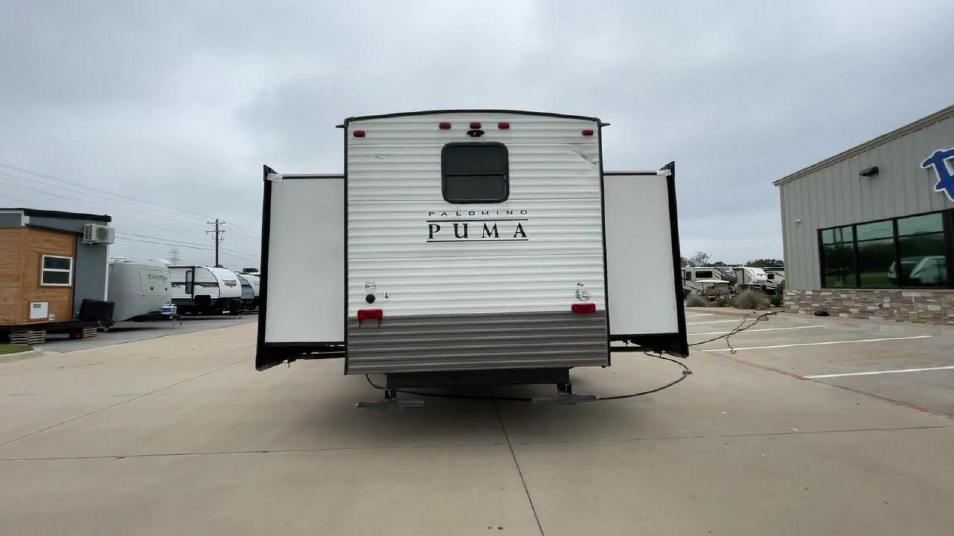 2021 TAN PUMA 39PQB - (4X4TPUR25MP) , located at 4319 N Main Street, Cleburne, TX, 76033, (817) 221-0660, 32.435829, -97.384178 - This Puma Travel Trailer measures just over 42 feet long and 8 feet wide with a dry weight of 10,709 lbs. It has a GVWR of 13,413 lbs and a hitch weight of 1,413 lbs. This unit comes with automatic heating and cooling rated at 35,000 and 13,500 BTUs respectively. The exterior of this unit is a base - Photo#8