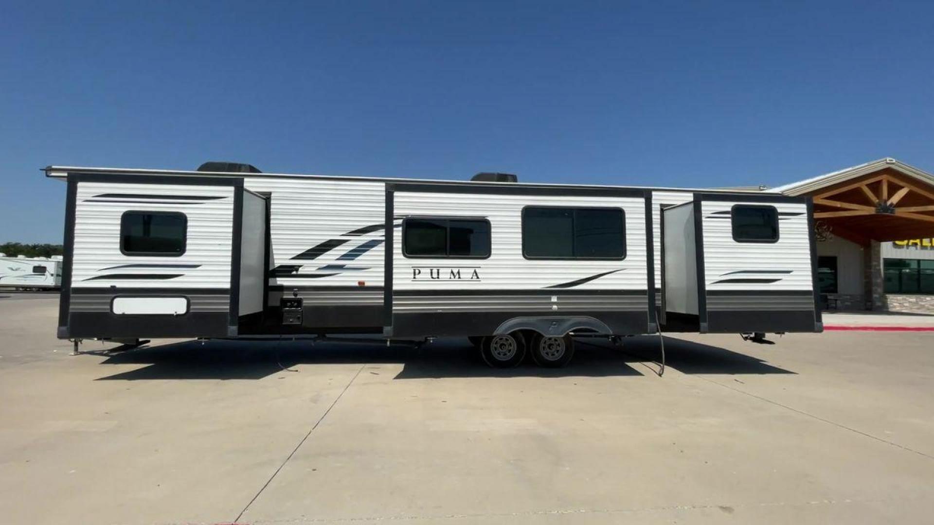 2021 PUMA 39PQB - (4X4TPUR23MP) , located at 4319 N Main Street, Cleburne, TX, 76033, (817) 221-0660, 32.435829, -97.384178 - This Puma Travel Trailer measures just over 42 feet long and 8 feet wide with a dry weight of 10,709 lbs. It has a GVWR of 13,413 lbs and a hitch weight of 1,413 lbs. This unit comes with automatic heating and cooling rated at 35,000 and 13,500 BTUs respectively. The exterior of this unit is a base - Photo#6