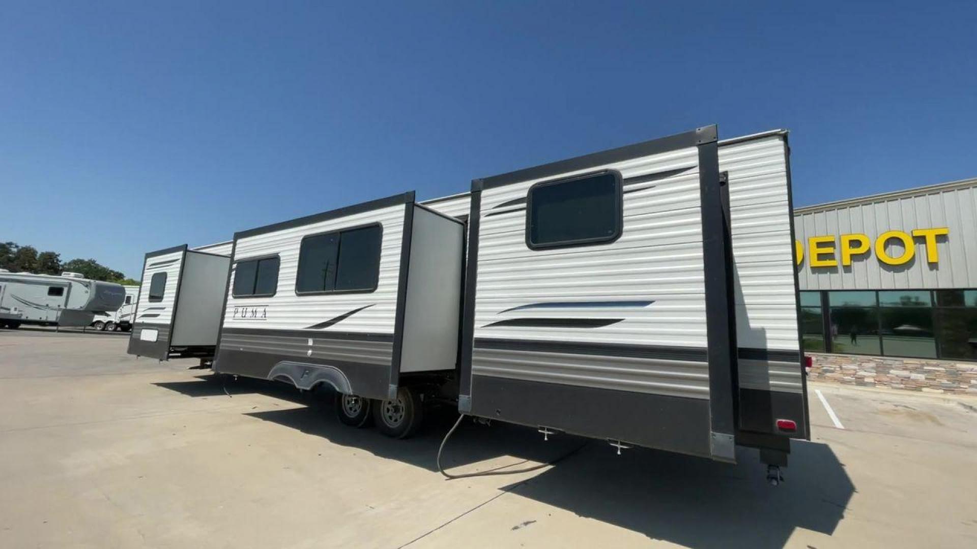 2021 PUMA 39PQB - (4X4TPUR23MP) , located at 4319 N Main Street, Cleburne, TX, 76033, (817) 221-0660, 32.435829, -97.384178 - This Puma Travel Trailer measures just over 42 feet long and 8 feet wide with a dry weight of 10,709 lbs. It has a GVWR of 13,413 lbs and a hitch weight of 1,413 lbs. This unit comes with automatic heating and cooling rated at 35,000 and 13,500 BTUs respectively. The exterior of this unit is a base - Photo#7