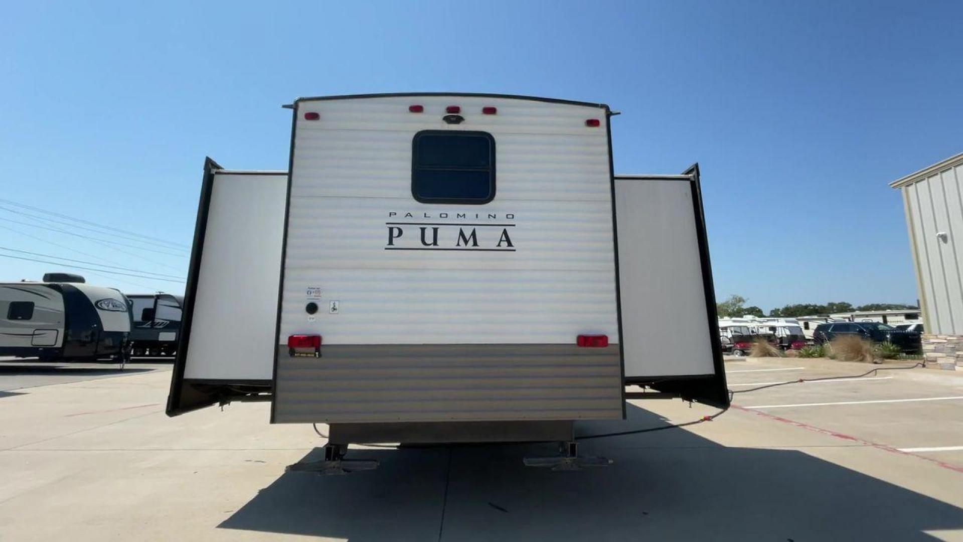 2021 PUMA 39PQB - (4X4TPUR23MP) , located at 4319 N Main Street, Cleburne, TX, 76033, (817) 221-0660, 32.435829, -97.384178 - This Puma Travel Trailer measures just over 42 feet long and 8 feet wide with a dry weight of 10,709 lbs. It has a GVWR of 13,413 lbs and a hitch weight of 1,413 lbs. This unit comes with automatic heating and cooling rated at 35,000 and 13,500 BTUs respectively. The exterior of this unit is a base - Photo#8