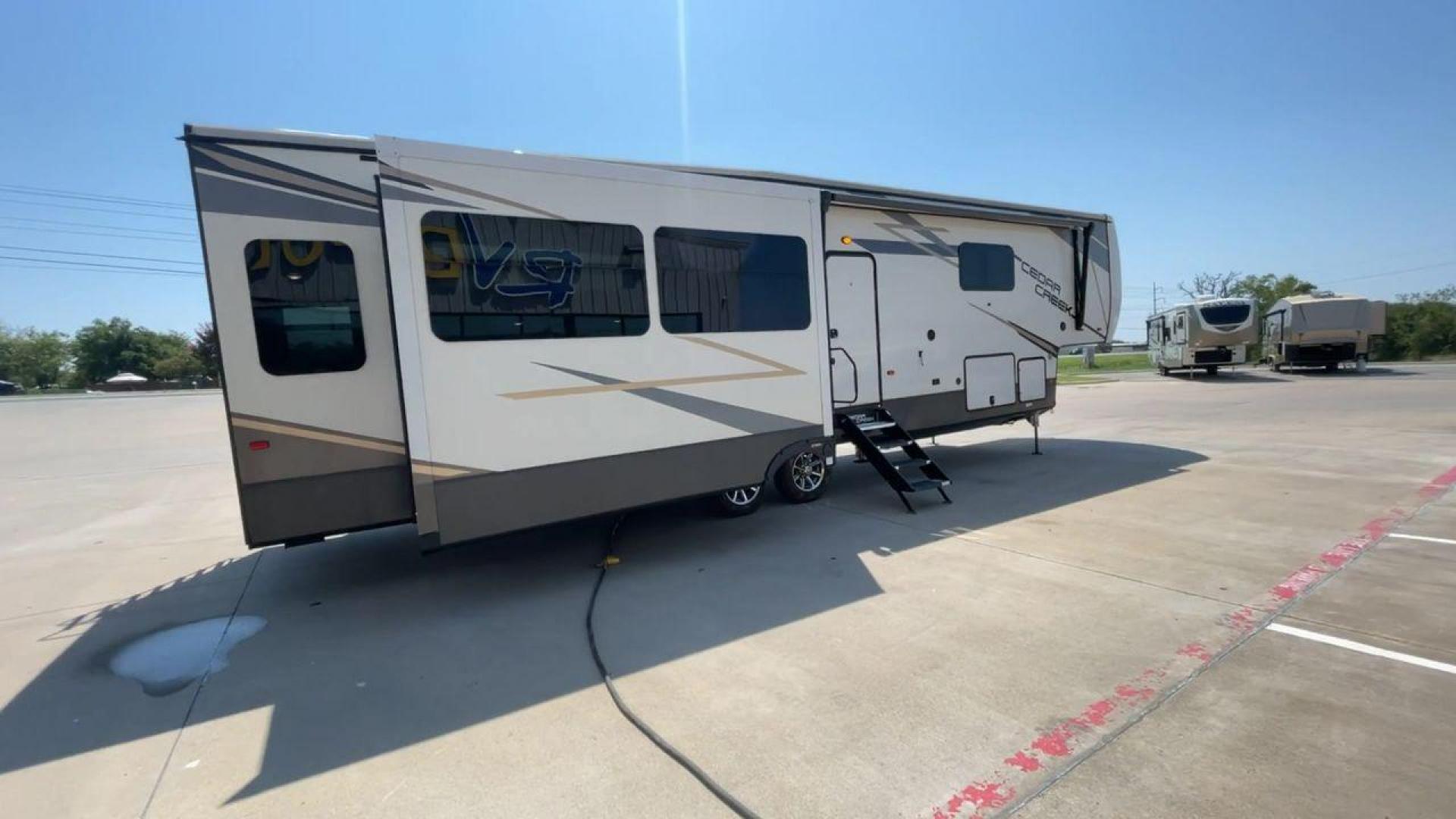 2022 FOREST RIVER CEDAR CREEK 388WDM (4X4FCRR23NS) , Length: 41.5 ft. | Dry Weight: 13,085 lbs. | Slides: 3 transmission, located at 4319 N Main Street, Cleburne, TX, 76033, (817) 221-0660, 32.435829, -97.384178 - Photo#1