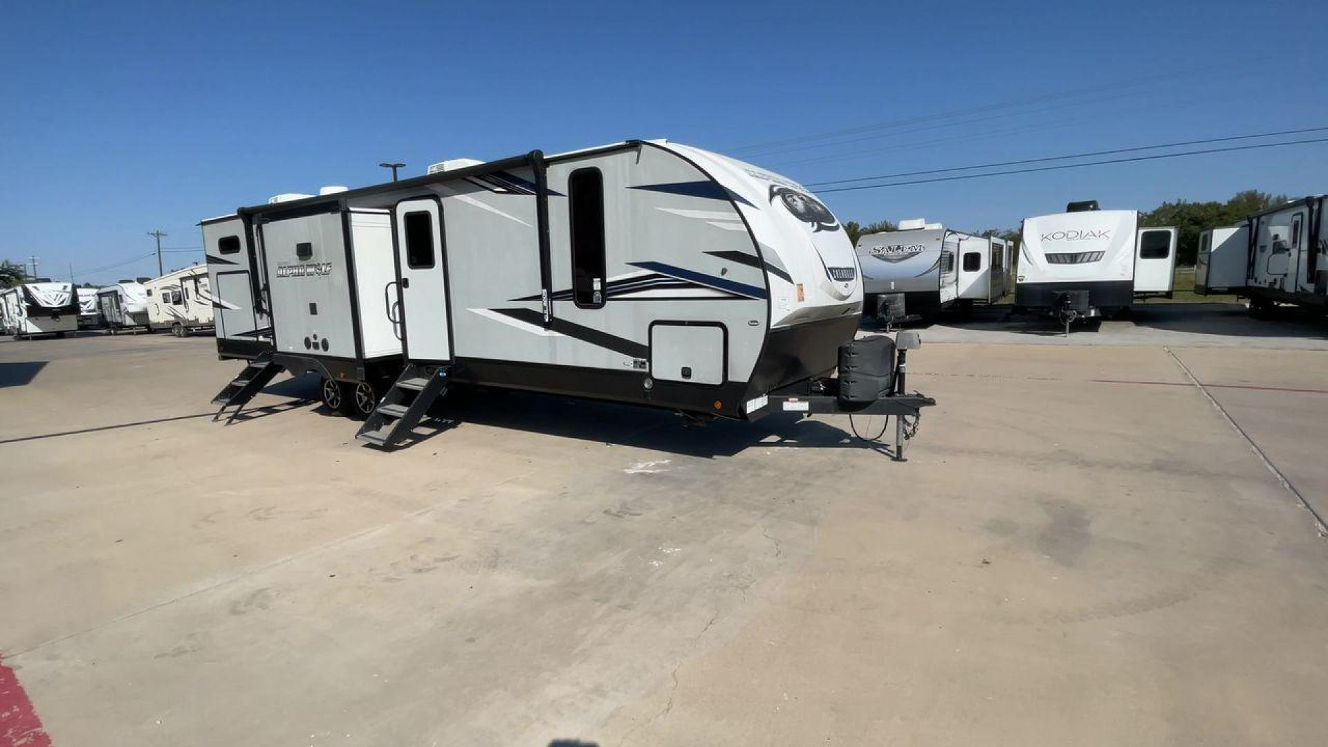 2022 FOREST RIVER CHEROKEE 33BH-L (5ZT2CKYBXN2) , Length: 37.33 ft. | Dry Weight: 7,986 lbs. | Gross Weight: 9,863 lbs. | Slides: 2 transmission, located at 4319 N Main Street, Cleburne, TX, 76033, (817) 221-0660, 32.435829, -97.384178 - The 2022 Forest River Cherokee Alpha Wolf 33BH-L showcases a modern and sleek exterior which is perfectly built for extended road adventures. Measuring 37.33 feet in length, it features a two-tone gray and black color scheme with sharp, angular graphics that give it a contemporary, aggressive look. - Photo#3