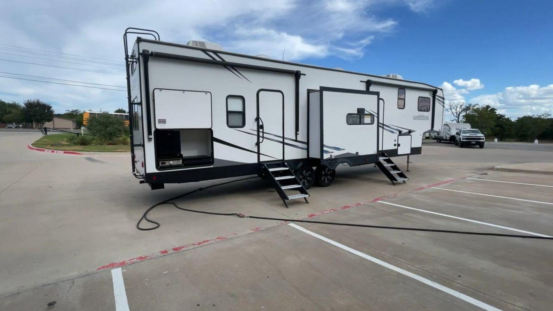 2022 FOREST RIVER IMPRESSION 330BH (5ZT3MPYB4ND) , Length: 41 ft. | Dry Weight: 10,433 lbs. | Gross Weight: 14,165 lbs. | Slides: 3 transmission, located at 4319 N Main Street, Cleburne, TX, 76033, (817) 221-0660, 32.435829, -97.384178 - Photo#1