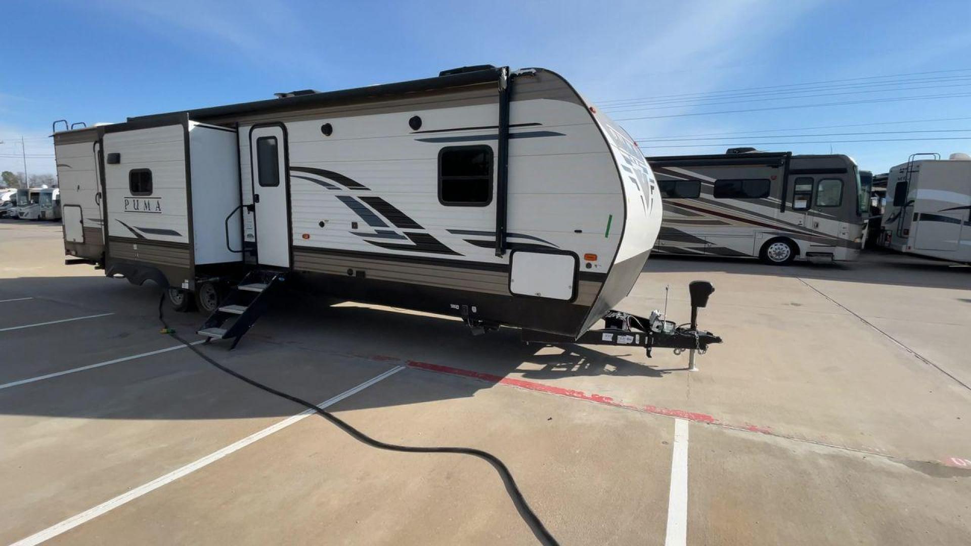 2022 FOREST RIVER PUMA 32BH2B (4X4TPUH22NP) , Length: 38.5 ft. | Dry Weight: 9,023 lbs. | Gross Weight: 11,230 lbs. | Slides: 3 transmission, located at 4319 N Main Street, Cleburne, TX, 76033, (817) 221-0660, 32.435829, -97.384178 - The 2022 Forest River Puma 32BH2B is a feature-packed travel trailer designed for families and large groups who value comfort, convenience, and versatility. With its thoughtful layout, dual bathrooms, and sleeping accommodations for up to 10 people, this RV is perfect for memorable adventures. The d - Photo#3