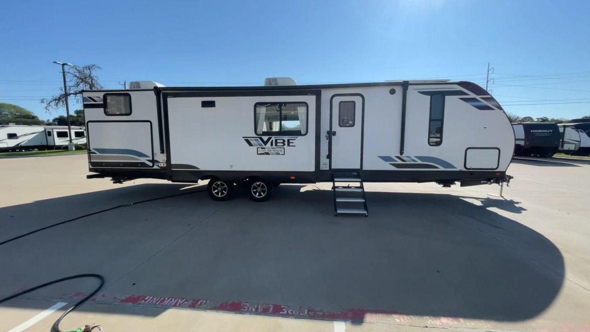 2022 FOREST RIVER VIBE 34BH (4X4TVBK21N4) , Length: 39.42 ft. | Dry Weight: 8,164 lbs. | Slides: 3 transmission, located at 4319 N Main Street, Cleburne, TX, 76033, (817) 221-0660, 32.435829, -97.384178 - Photo#2