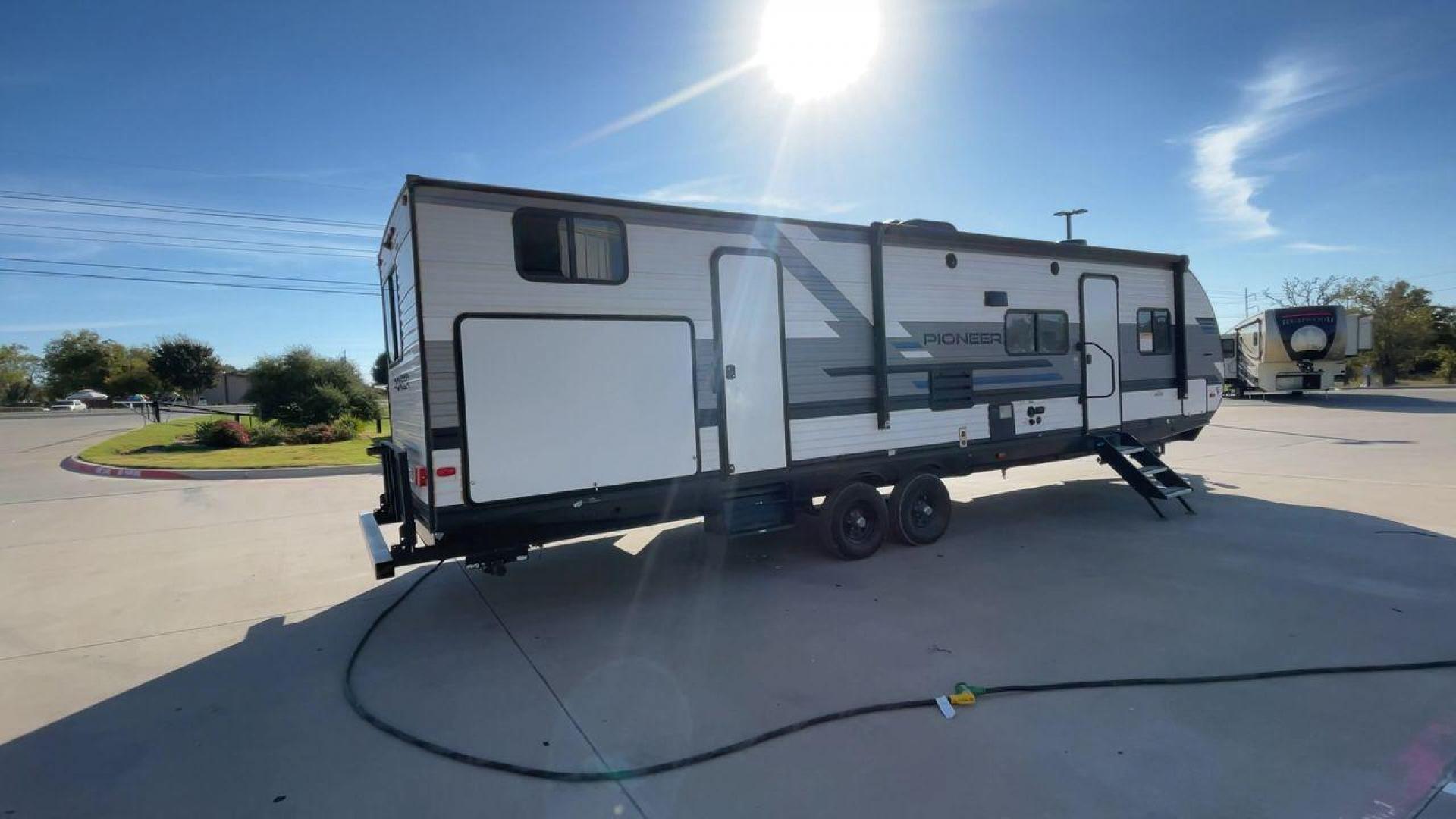 2022 HEARTLAND PIONEER DS320 (5SFPB3725NE) , Length: 37.36 ft. | Dry Weight: 7,696 lbs. | Gross Weight: 9,000 lbs. | Slides: 2 transmission, located at 4319 N Main Street, Cleburne, TX, 76033, (817) 221-0660, 32.435829, -97.384178 - The 2022 Heartland Pioneer DS320 is a spacious and stylish RV designed for comfortable travel and camping. With a length of 37.36 feet and a dry weight of 7,696 lbs., it offers ample living space while being relatively simple to tow. Its exterior features a sleek combination of white and gray with d - Photo#1