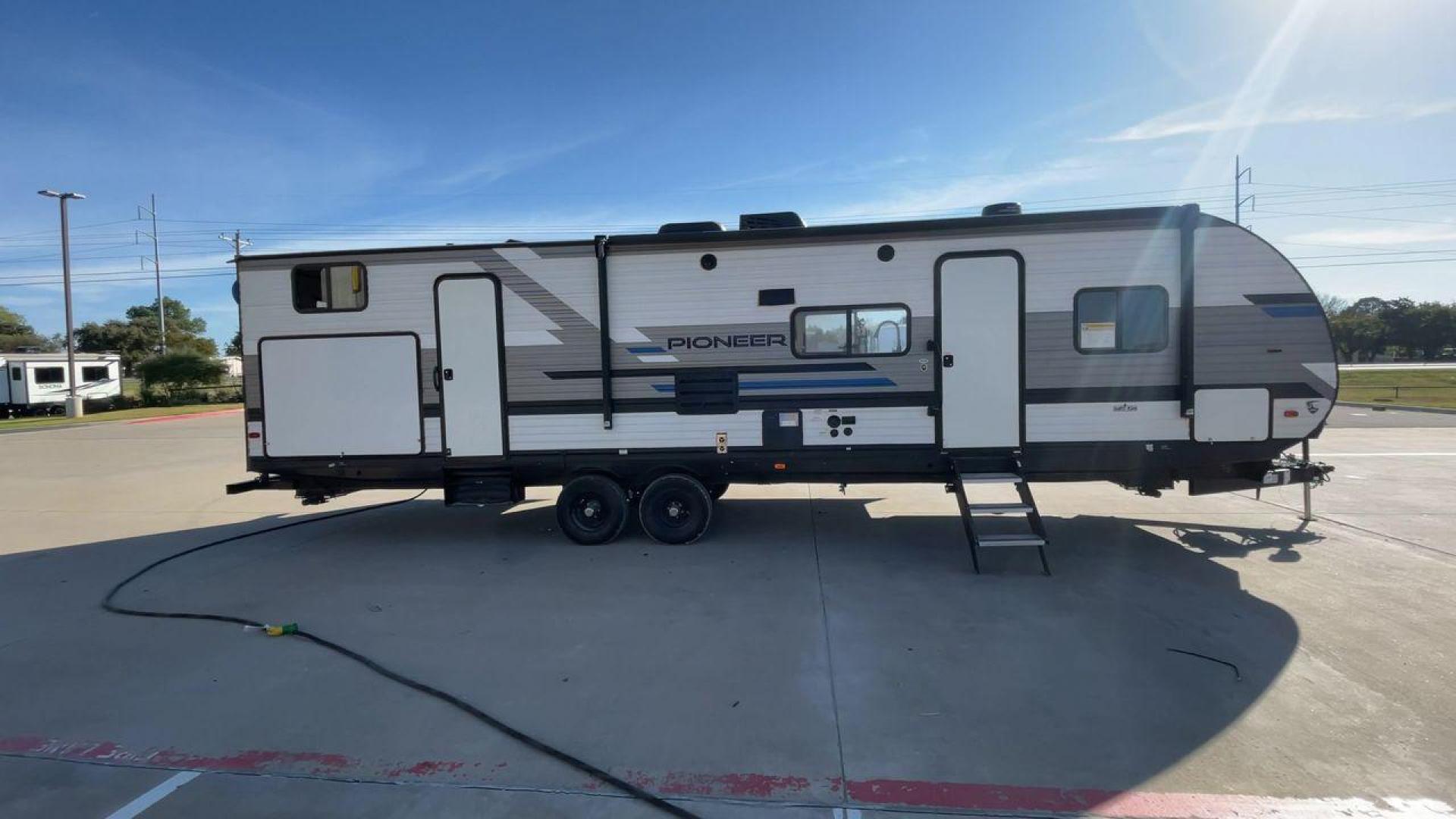 2022 HEARTLAND PIONEER DS320 (5SFPB3725NE) , Length: 37.36 ft. | Dry Weight: 7,696 lbs. | Gross Weight: 9,000 lbs. | Slides: 2 transmission, located at 4319 N Main Street, Cleburne, TX, 76033, (817) 221-0660, 32.435829, -97.384178 - The 2022 Heartland Pioneer DS320 is a spacious and stylish RV designed for comfortable travel and camping. With a length of 37.36 feet and a dry weight of 7,696 lbs., it offers ample living space while being relatively simple to tow. Its exterior features a sleek combination of white and gray with d - Photo#2