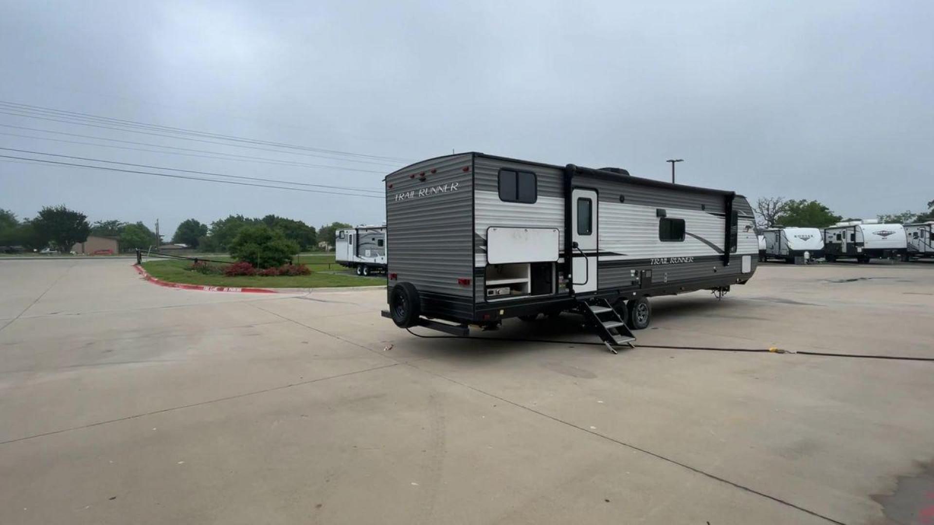 2022 HEARTLAND TRAIL RUNNER 31DB (5SFEB3724NE) , Length: 36.92 ft. | Dry Weight: 7,040 lbs. | Gross Weight: 9,642 lbs. | Slides: 1 transmission, located at 4319 N Main Street, Cleburne, TX, 76033, (817) 221-0660, 32.435829, -97.384178 - The 2022 Heartland Trail Runner 31DB is a flexible, family-friendly travel trailer that will make your camping trip more enjoyable. With a length of 36.92 feet and a dry weight of 7,040 pounds, this trailer gives you plenty of room and comfort for your trips. The gross weight of 9,642 pounds means t - Photo#1