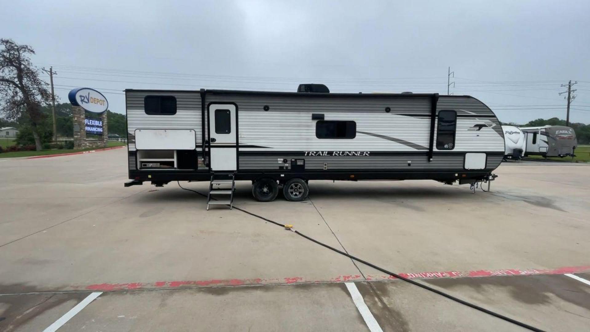 2022 HEARTLAND TRAIL RUNNER 31DB (5SFEB3724NE) , Length: 36.92 ft. | Dry Weight: 7,040 lbs. | Gross Weight: 9,642 lbs. | Slides: 1 transmission, located at 4319 N Main Street, Cleburne, TX, 76033, (817) 221-0660, 32.435829, -97.384178 - The 2022 Heartland Trail Runner 31DB is a flexible, family-friendly travel trailer that will make your camping trip more enjoyable. With a length of 36.92 feet and a dry weight of 7,040 pounds, this trailer gives you plenty of room and comfort for your trips. The gross weight of 9,642 pounds means t - Photo#2