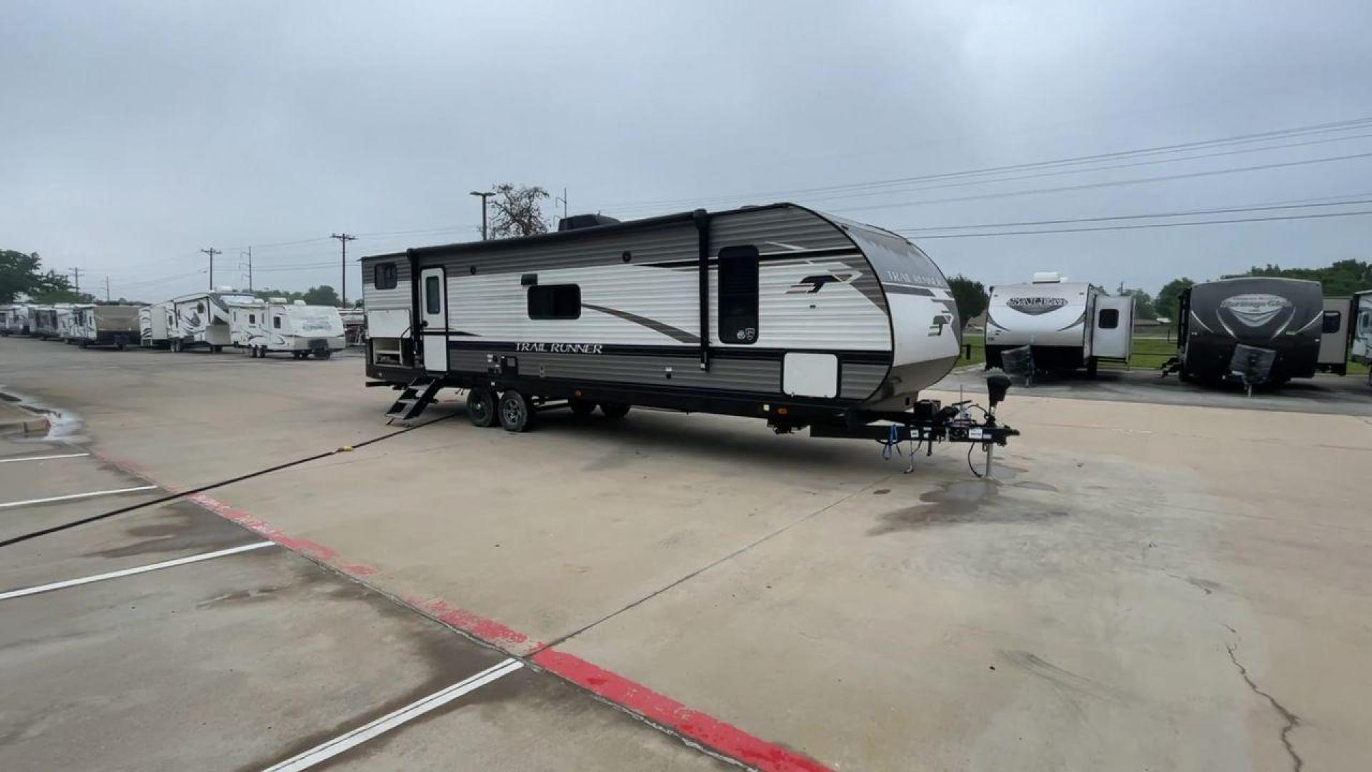 2022 HEARTLAND TRAIL RUNNER 31DB (5SFEB3724NE) , Length: 36.92 ft. | Dry Weight: 7,040 lbs. | Gross Weight: 9,642 lbs. | Slides: 1 transmission, located at 4319 N Main Street, Cleburne, TX, 76033, (817) 221-0660, 32.435829, -97.384178 - The 2022 Heartland Trail Runner 31DB is a flexible, family-friendly travel trailer that will make your camping trip more enjoyable. With a length of 36.92 feet and a dry weight of 7,040 pounds, this trailer gives you plenty of room and comfort for your trips. The gross weight of 9,642 pounds means t - Photo#3