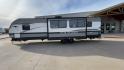 2022 HEARTLAND TRAIL RUNNER 31DB (5SFEB372XNE) , Length: 36.92 ft. | Dry Weight: 7,040 lbs. | Gross Weight: 9,642 lbs. | Slides: 1 transmission, located at 4319 N Main Street, Cleburne, TX, 76033, (817) 221-0660, 32.435829, -97.384178 - The 2022 Heartland Trail Runner 31DB has a robust and functional exterior design with modern accents. The front cap of the RV is curved for better aerodynamics, with the bold Trail Runner logo prominently displayed. The front also features a black diamond-plate guard, which offers protection from de - Photo#6