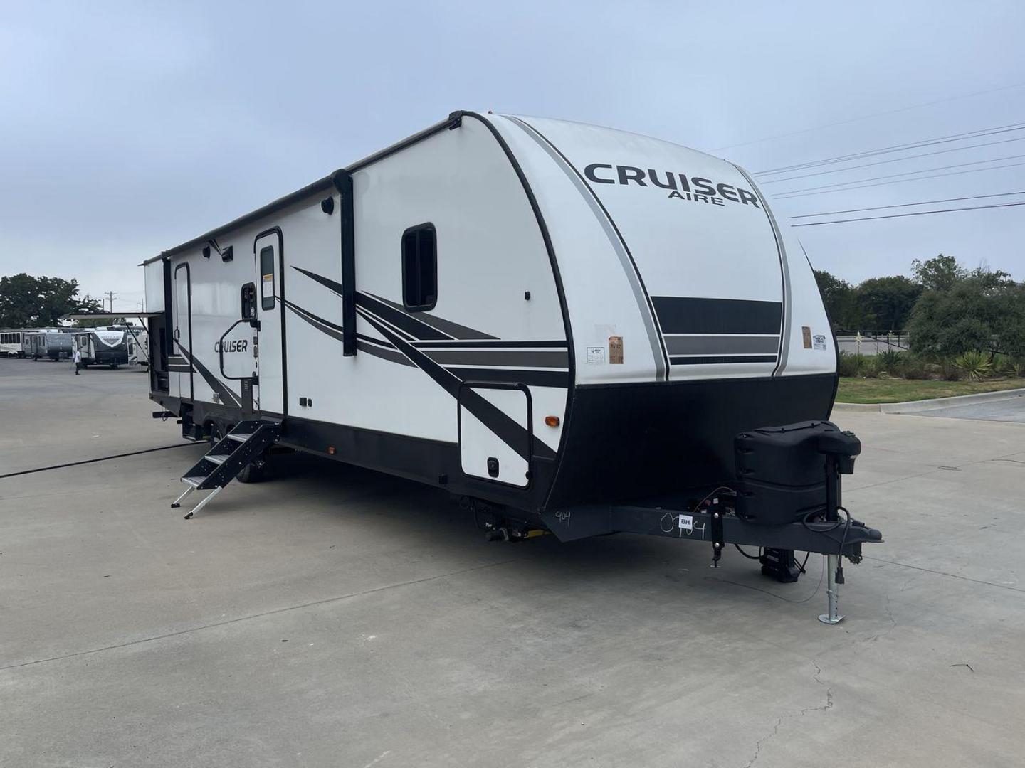 2022 KEYSTONE CRUISER 33BHB (4YDTCRS28N6) , Length: 37.83 ft. | Dry Weight: 7,832 lbs. | Slides: 2 transmission, located at 4319 N Main Street, Cleburne, TX, 76033, (817) 221-0660, 32.435829, -97.384178 - The 2022 Keystone Cruiser 33BHB has a sleek, modern exterior design. The front showcases a rounded, aerodynamic front cap with the Cruiser Aire branding prominently displayed. The body of the RV is predominantly white, accented with stylish black and gray graphic designs that add a sharp, streamline - Photo#22