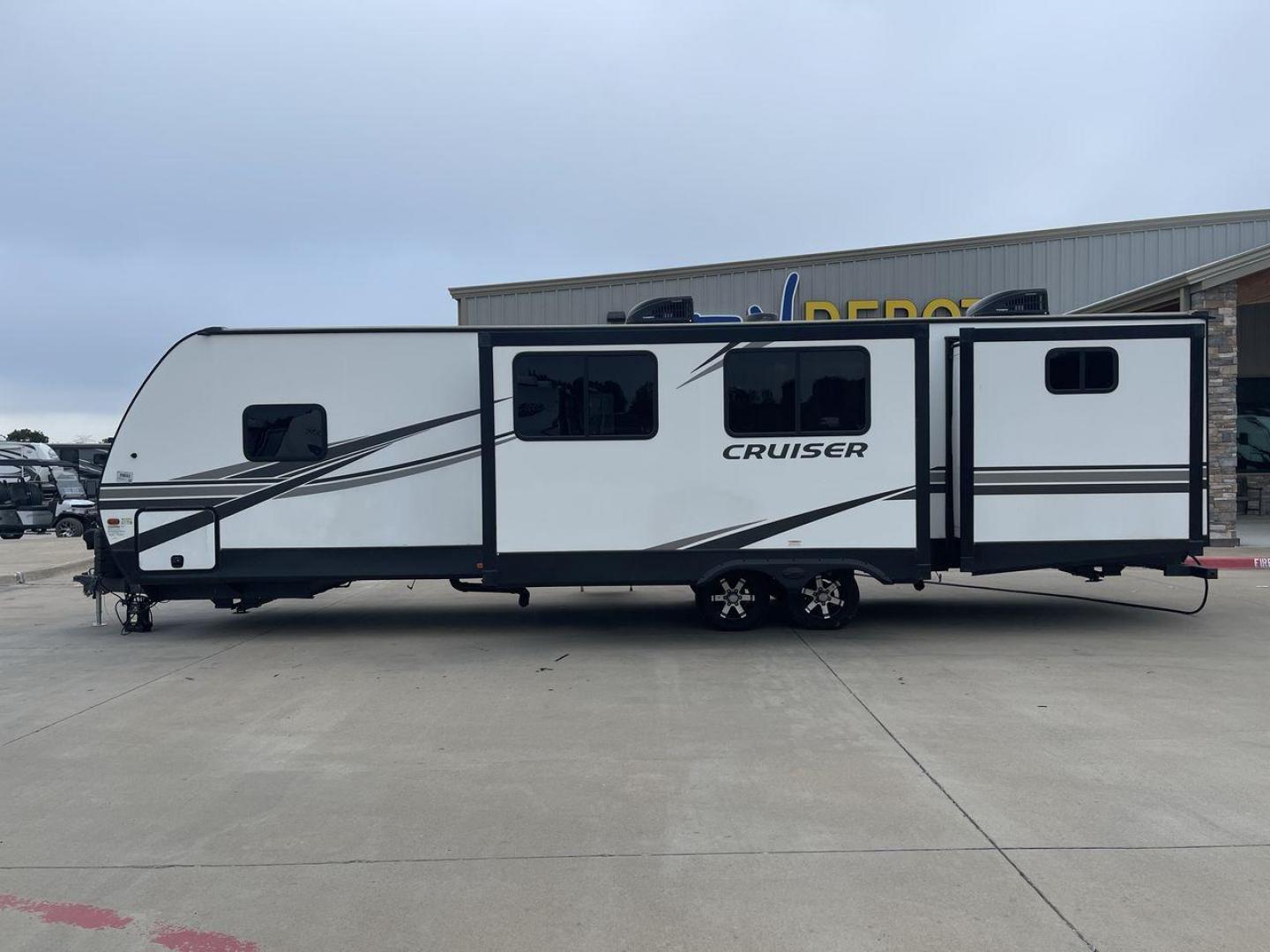 2022 KEYSTONE CRUISER 33BHB (4YDTCRS28N6) , Length: 37.83 ft. | Dry Weight: 7,832 lbs. | Slides: 2 transmission, located at 4319 N Main Street, Cleburne, TX, 76033, (817) 221-0660, 32.435829, -97.384178 - The 2022 Keystone Cruiser 33BHB has a sleek, modern exterior design. The front showcases a rounded, aerodynamic front cap with the Cruiser Aire branding prominently displayed. The body of the RV is predominantly white, accented with stylish black and gray graphic designs that add a sharp, streamline - Photo#23