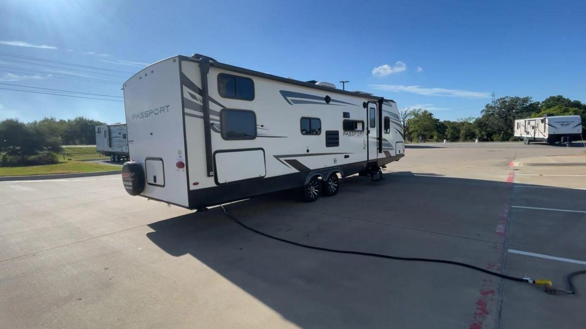 2022 KEYSTONE PASSPORT 282QB (4YDTPPN29NK) , Length: 32.92 ft. | Dry Weight: 6,145 lbs. | Gross Weight: 7,700 lbs. | Slides: 1 transmission, located at 4319 N Main Street, Cleburne, TX, 76033, (817) 221-0660, 32.435829, -97.384178 - Photo#1