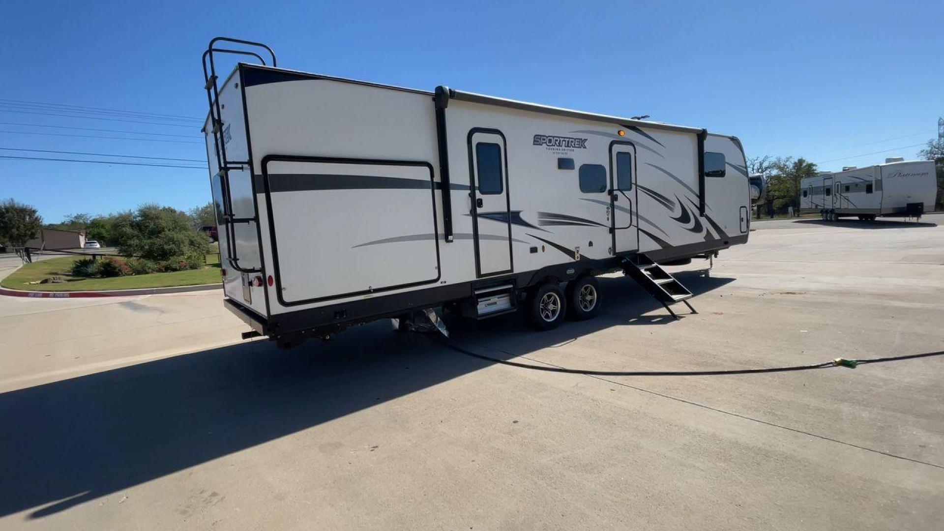 2022 KZ SPORT TREK 343VBH (4EZT13423N8) , Length: 37.67 ft. | Dry Weight: 8,820 lbs. | Slides: 3 transmission, located at 4319 N Main Street, Cleburne, TX, 76033, (817) 221-0660, 32.435829, -97.384178 - The 2022 Venture RV Sport Trek 343VBH showcases a sleek and modern exterior with a bright white finish and stylish graphics. It stretches an impressive 37.67 feet. This unit is equipped with a power tongue jack and propane tanks at the front for easy hitching and extended camping capabilities. The s - Photo#1