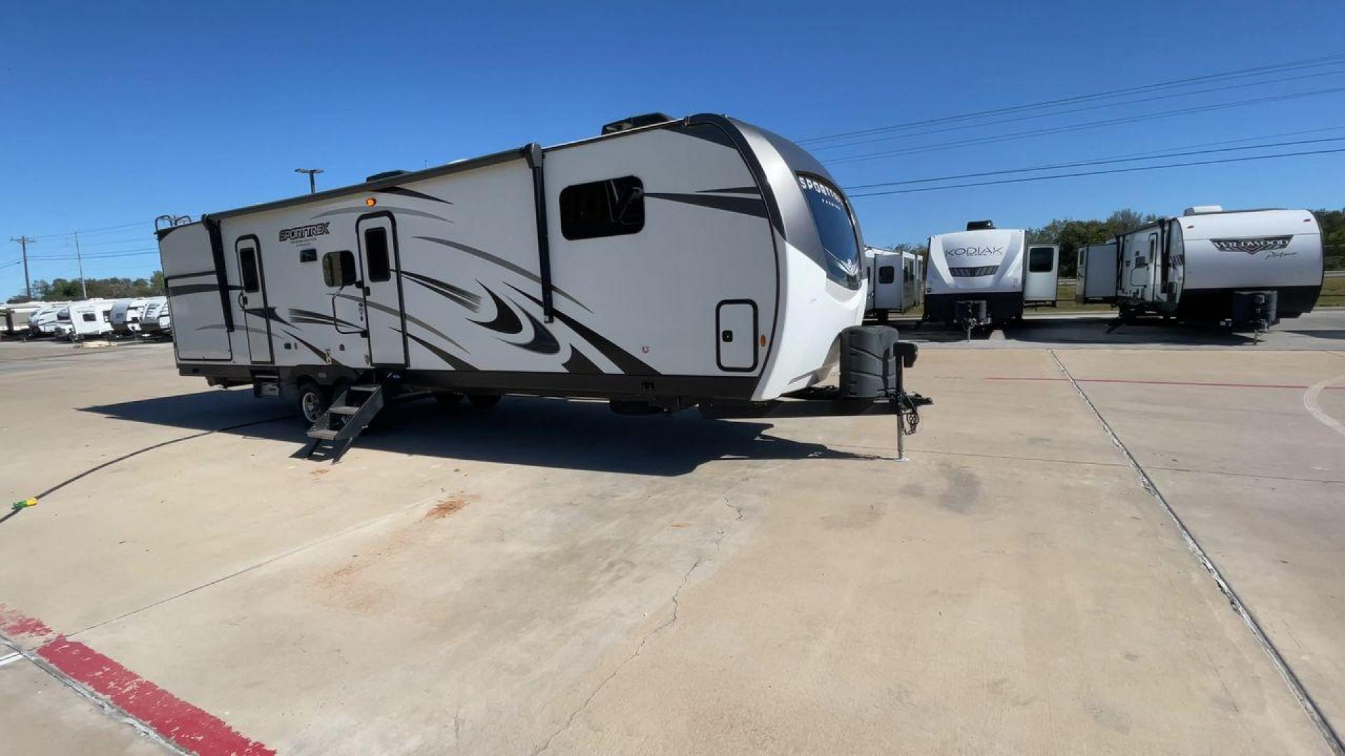 2022 KZ SPORT TREK 343VBH (4EZT13423N8) , Length: 37.67 ft. | Dry Weight: 8,820 lbs. | Slides: 3 transmission, located at 4319 N Main Street, Cleburne, TX, 76033, (817) 221-0660, 32.435829, -97.384178 - The 2022 Venture RV Sport Trek 343VBH showcases a sleek and modern exterior with a bright white finish and stylish graphics. It stretches an impressive 37.67 feet. This unit is equipped with a power tongue jack and propane tanks at the front for easy hitching and extended camping capabilities. The s - Photo#3