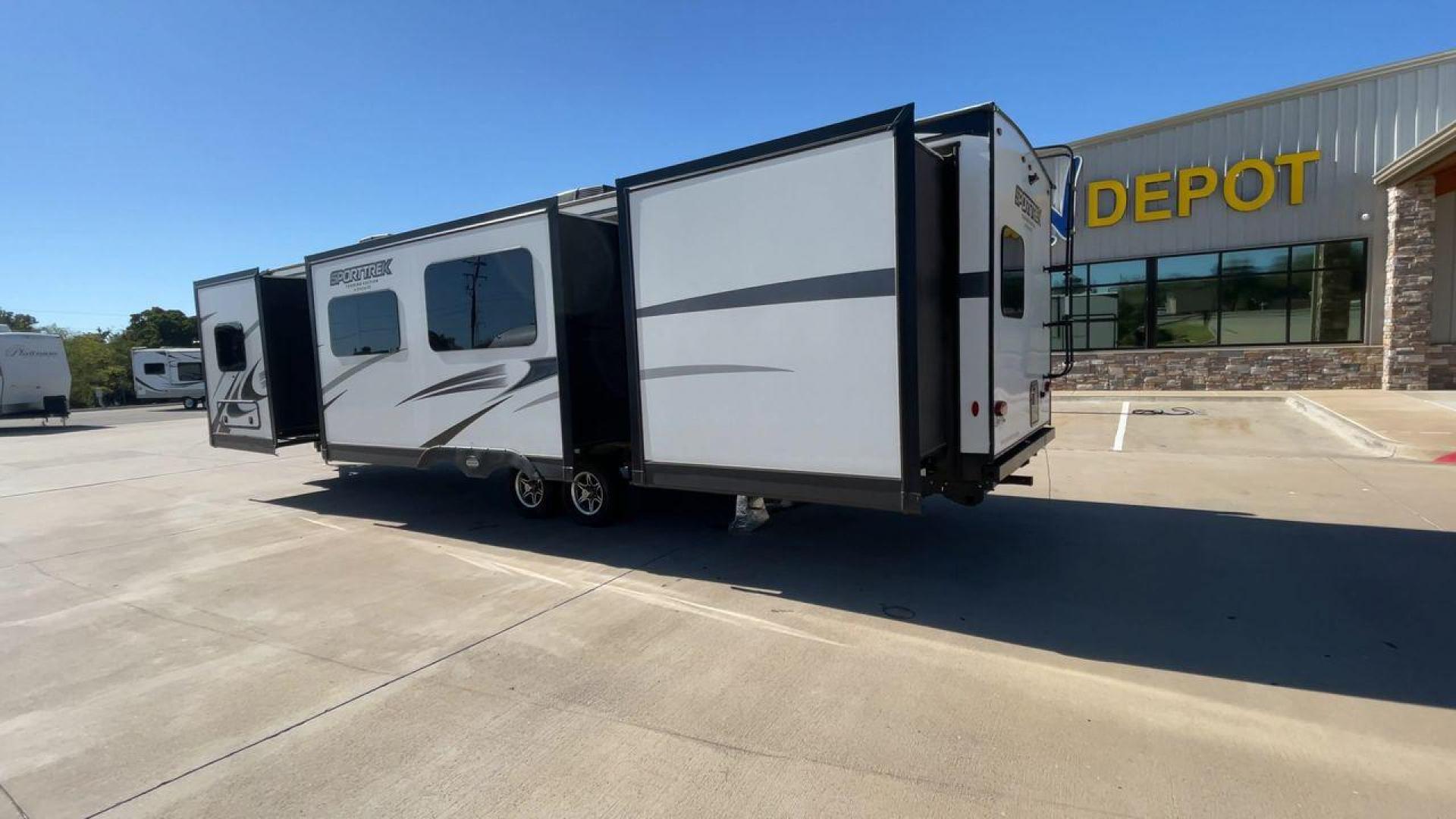 2022 KZ SPORT TREK 343VBH (4EZT13423N8) , Length: 37.67 ft. | Dry Weight: 8,820 lbs. | Slides: 3 transmission, located at 4319 N Main Street, Cleburne, TX, 76033, (817) 221-0660, 32.435829, -97.384178 - The 2022 Venture RV Sport Trek 343VBH showcases a sleek and modern exterior with a bright white finish and stylish graphics. It stretches an impressive 37.67 feet. This unit is equipped with a power tongue jack and propane tanks at the front for easy hitching and extended camping capabilities. The s - Photo#7