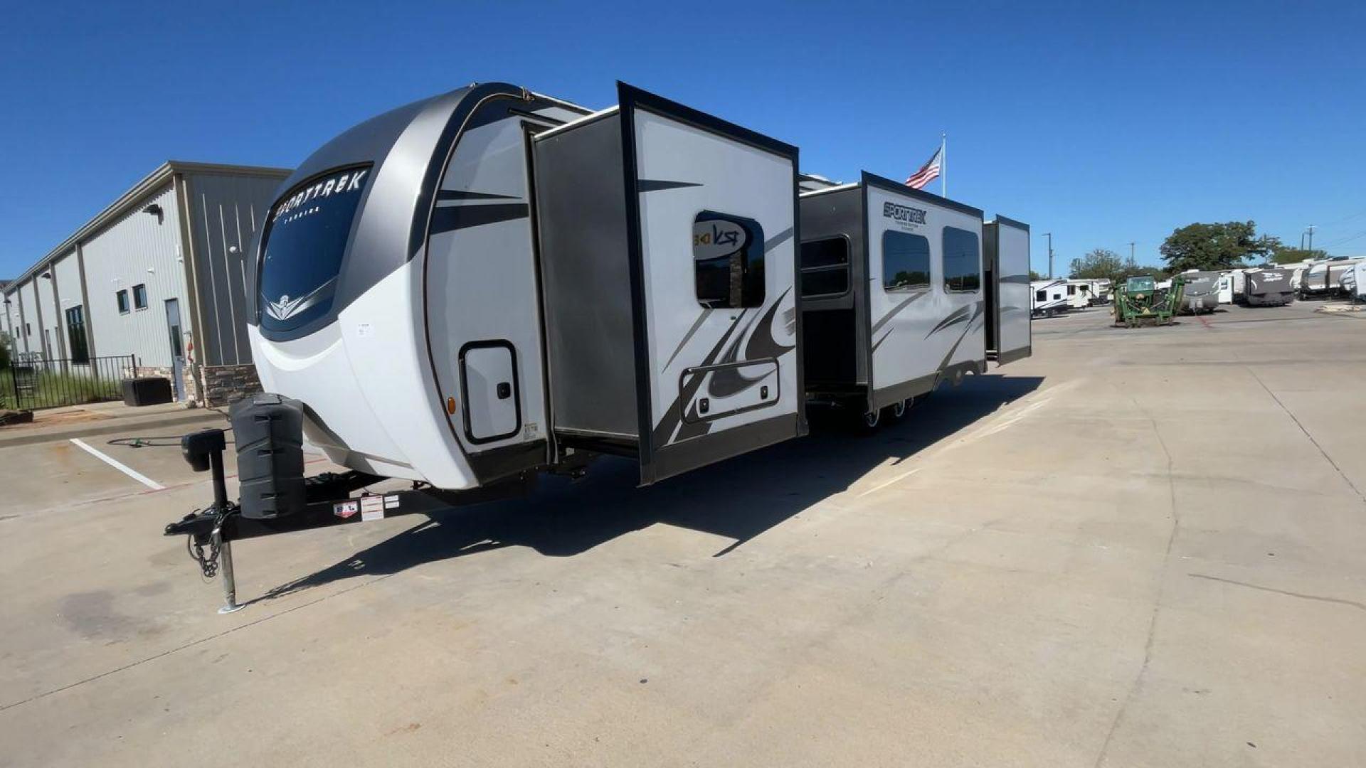 2022 KZ SPORT TREK 343VBH (4EZT13423N8) , Length: 37.67 ft. | Dry Weight: 8,820 lbs. | Slides: 3 transmission, located at 4319 N Main Street, Cleburne, TX, 76033, (817) 221-0660, 32.435829, -97.384178 - The 2022 Venture RV Sport Trek 343VBH showcases a sleek and modern exterior with a bright white finish and stylish graphics. It stretches an impressive 37.67 feet. This unit is equipped with a power tongue jack and propane tanks at the front for easy hitching and extended camping capabilities. The s - Photo#5