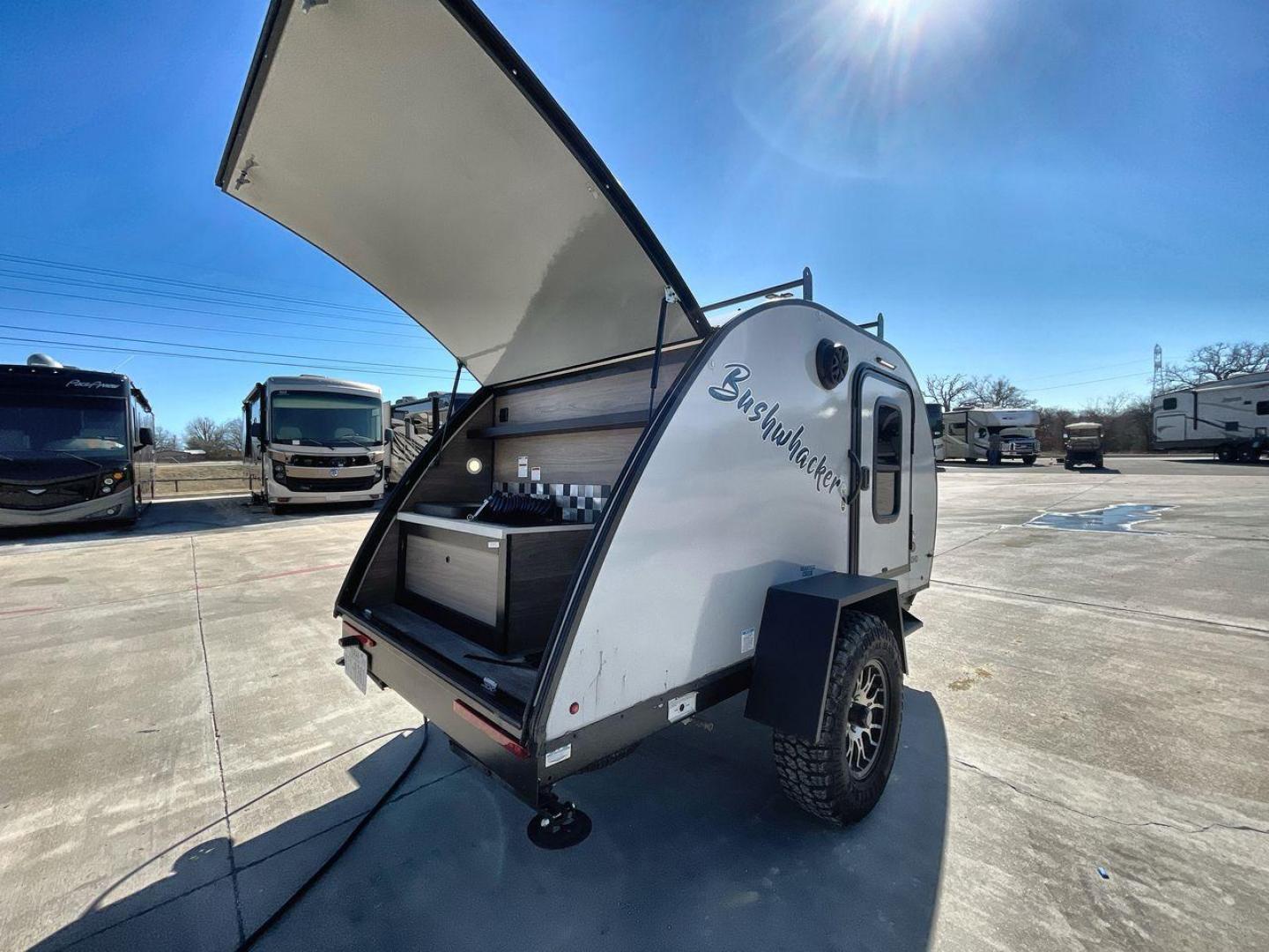 2023 BRAXTON CREEK BUSHWHACKER 10BH (7HFB1KB12P1) , Length: 10 ft | Dry Weight: 1,480 lbs | Gross Weight: 2,340 lbs | Slides: 0 transmission, located at 4319 N Main Street, Cleburne, TX, 76033, (817) 221-0660, 32.435829, -97.384178 - The exterior of this used Bushwhacker teardrop trailer is built for adventure with a compact yet sturdy design. Measuring 10 feet in length and weighing just 1,480 pounds dry, it's lightweight and easy to tow, making it perfect for off-road excursions. Its gross weight capacity of 2,340 pounds allow - Photo#14