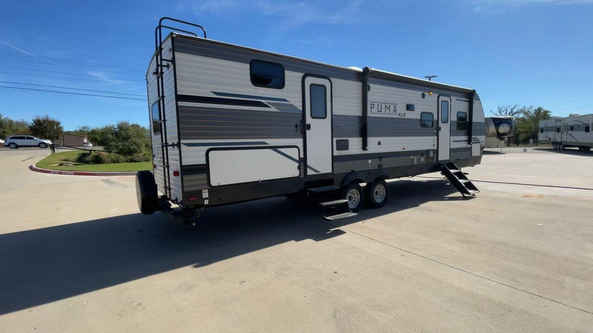 2023 FOREST RIVER PUMA 31BHSC (5ZT2PUWB4P4) , Length: 35.5 ft. | Dry Weight: 7,946 lbs. | Gross Weight: 9,600 lbs. | Slides: 2 transmission, located at 4319 N Main Street, Cleburne, TX, 76033, (817) 221-0660, 32.435829, -97.384178 - The 2023 Palomino Puma 31BHSC stands out with its sleek and modern exterior design. Measuring 35.5 feet in length, this unit is built for comfort and style. Its aluminum siding features a striking two-tone finish. With two large slide-outs, this RV offers expanded living space when parked. The front - Photo#1