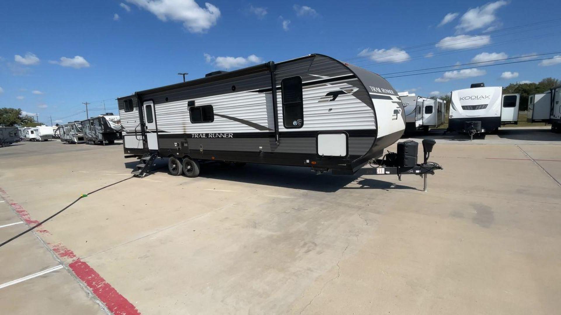 2023 HEARTLAND TRAIL RUNNER 31DB (5SFEB3723PE) , Length: 36.92 ft | Dry Weight: 7,040 lbs | GVWR: 9,642 lbs | Slides: 1 transmission, located at 4319 N Main Street, Cleburne, TX, 76033, (817) 221-0660, 32.435829, -97.384178 - The 2023 Heartland Trail Runner 31DB is a versatile and spacious travel trailer designed for families and adventure enthusiasts. This vehicle is the perfect option for families or groups looking to embark on memorable road trips. The travel trailer is a bunkhouse, and features a family-centric layou - Photo#3