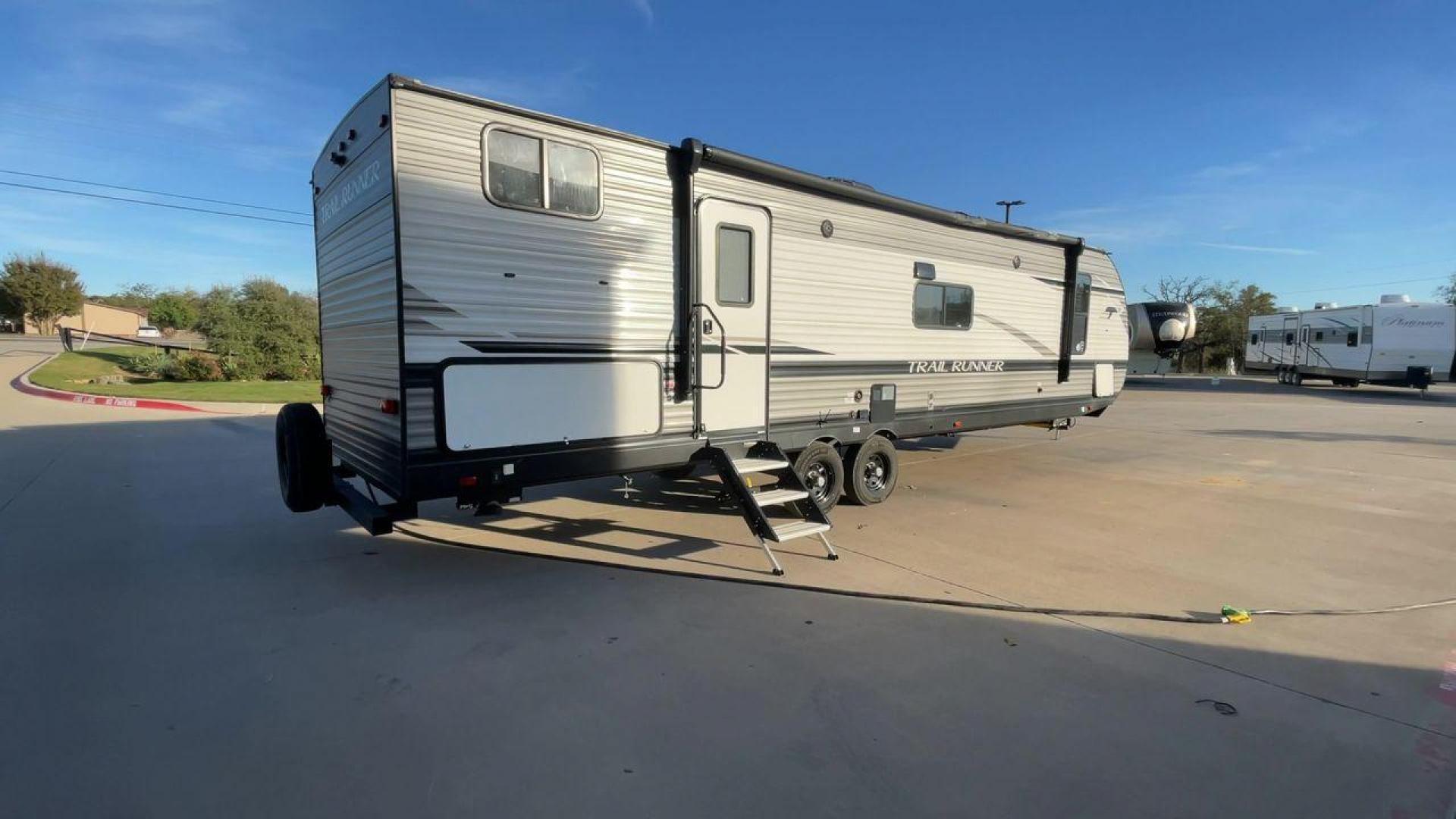 2023 HEARTLAND TRAIL RUNNER 31DB (5SFEB3721PE) , Length: 36.92 ft | Dry Weight: 7,040 lbs | GVWR: 9,642 lbs | Slides: 1 transmission, located at 4319 N Main Street, Cleburne, TX, 76033, (817) 221-0660, 32.435829, -97.384178 - A roomy and family-friendly travel trailer, the 2023 Heartland Trail Runner 31DB ensures a relaxing and delightful camping experience. This model accommodates larger parties and has contemporary conveniences to make your outdoor experiences unforgettable. It also has a well-designed floor plan. This - Photo#1