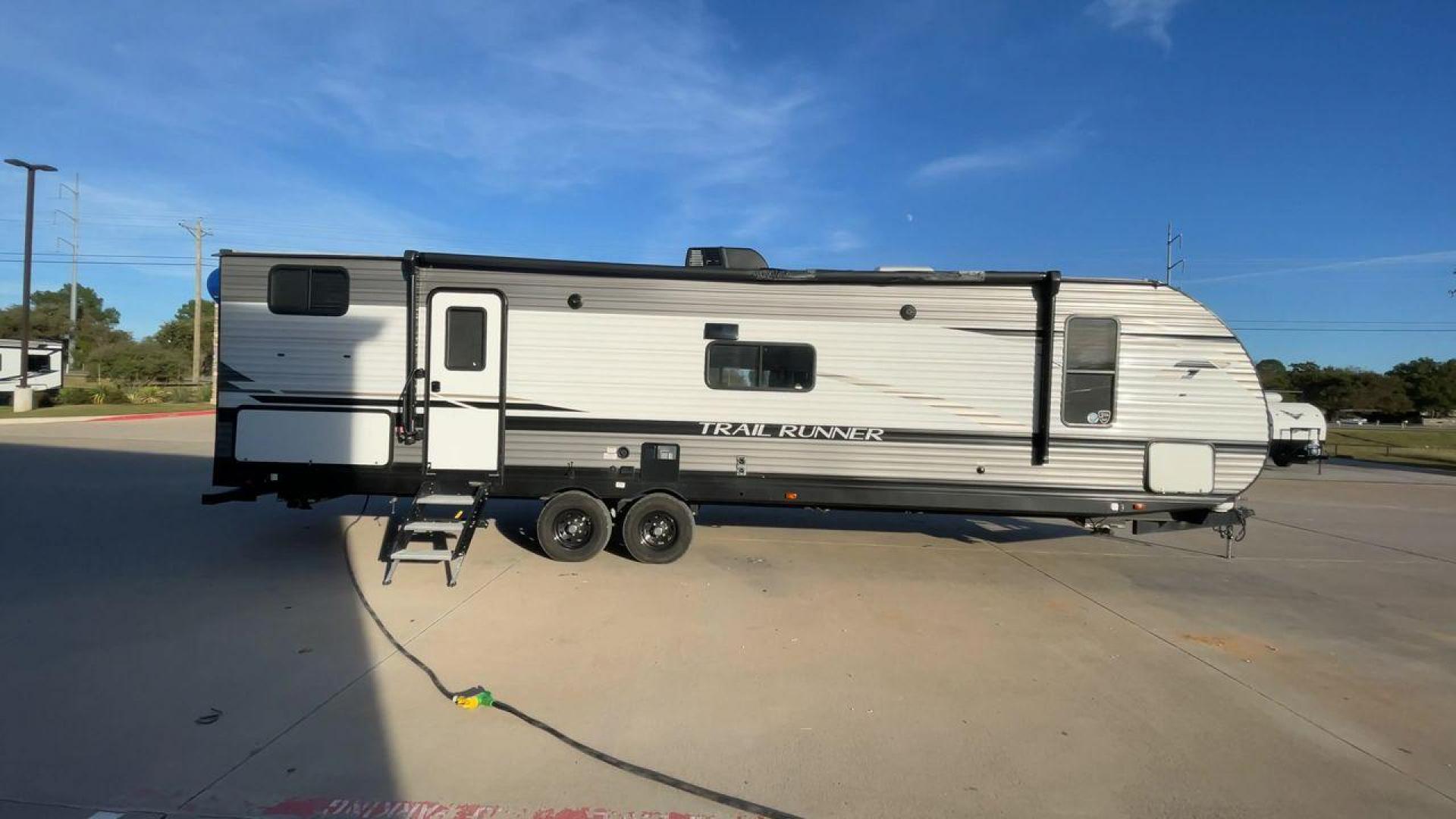 2023 HEARTLAND TRAIL RUNNER 31DB (5SFEB3721PE) , Length: 36.92 ft | Dry Weight: 7,040 lbs | GVWR: 9,642 lbs | Slides: 1 transmission, located at 4319 N Main Street, Cleburne, TX, 76033, (817) 221-0660, 32.435829, -97.384178 - A roomy and family-friendly travel trailer, the 2023 Heartland Trail Runner 31DB ensures a relaxing and delightful camping experience. This model accommodates larger parties and has contemporary conveniences to make your outdoor experiences unforgettable. It also has a well-designed floor plan. This - Photo#2